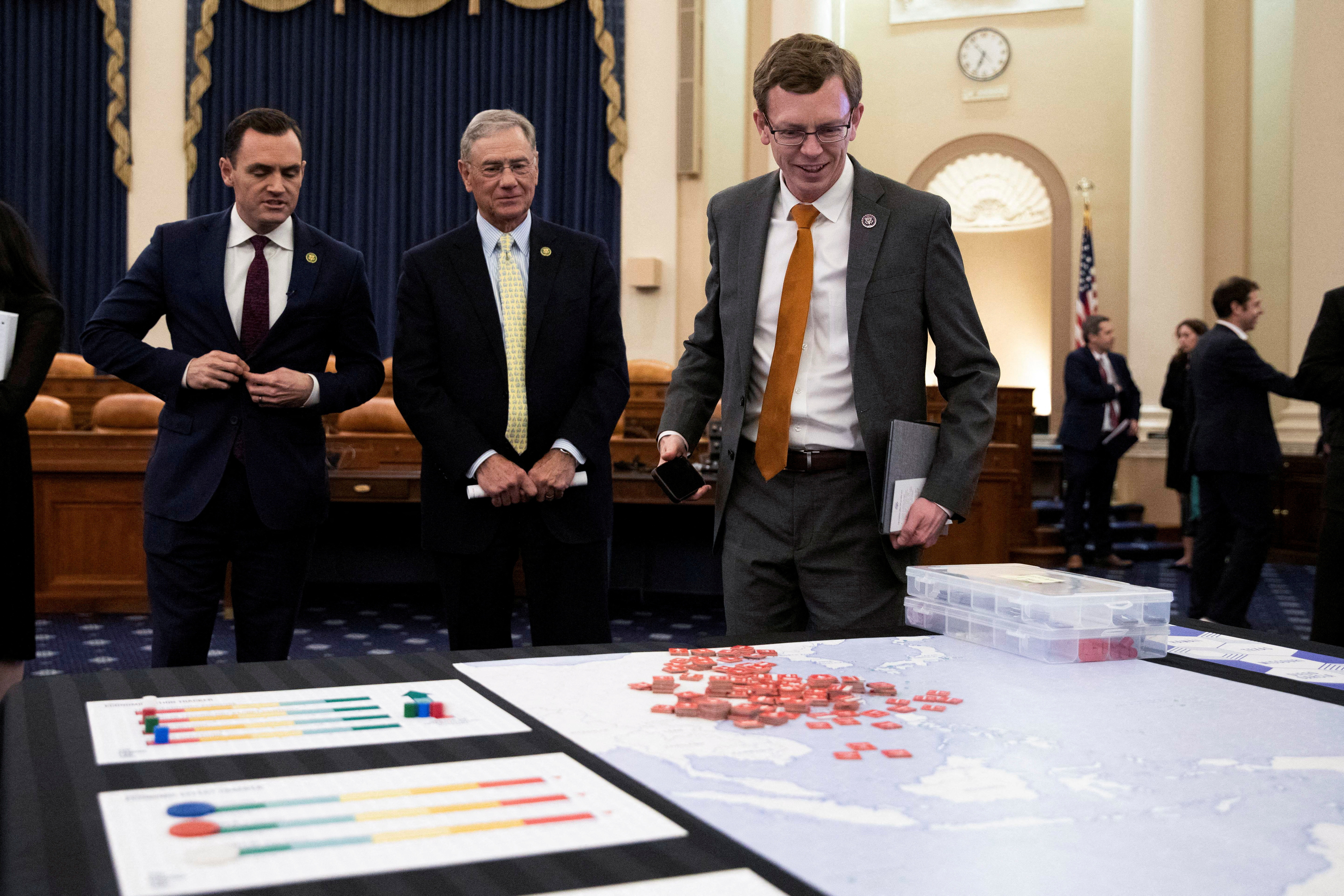 U.S. Rep. Dusty Johnson (R-SD) looks over a map during a House Select Committee on the Strategic Competition Between the United States and the Chinese Communist Party meeting on Capitol Hill in Washington, U.S., April 19, 2023. REUTERS/Amanda Andrade Rhoades/File Photo