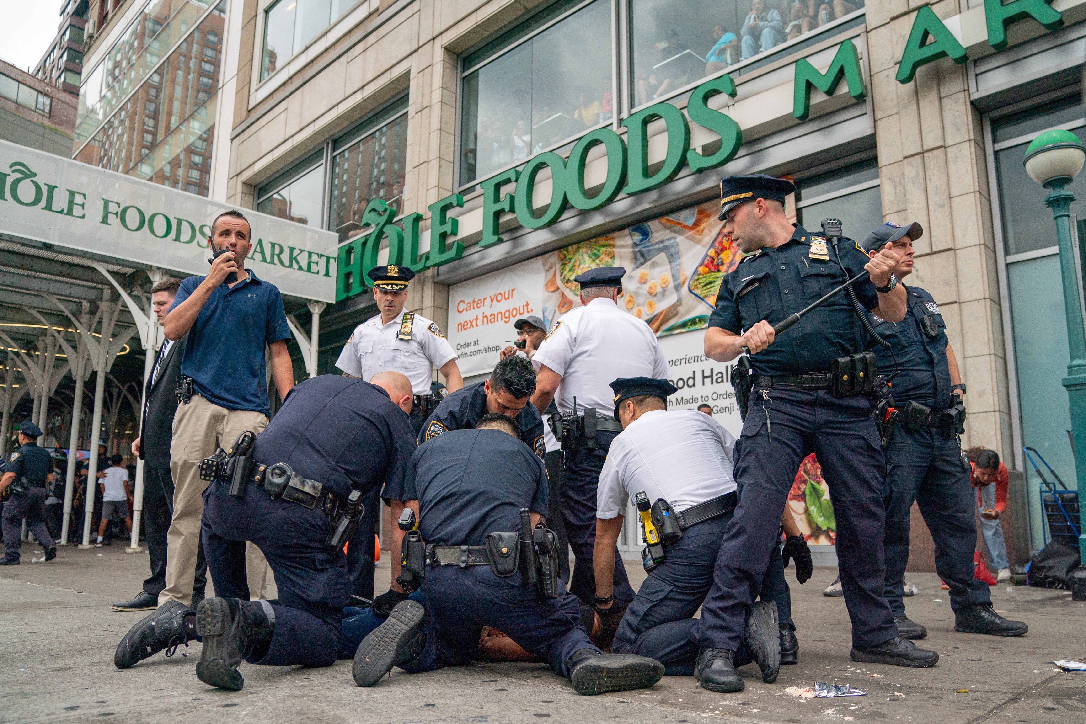 Police officers detain a person after popular live streamer Kai Cenat announced a "giveaway" event that grew chaotic, prompting police officers to respond and disperse the crowd at Union Square and the surrounding streets, in New York City, U.S. August 4, 2023. REUTERS/David 'Dee' Delgado