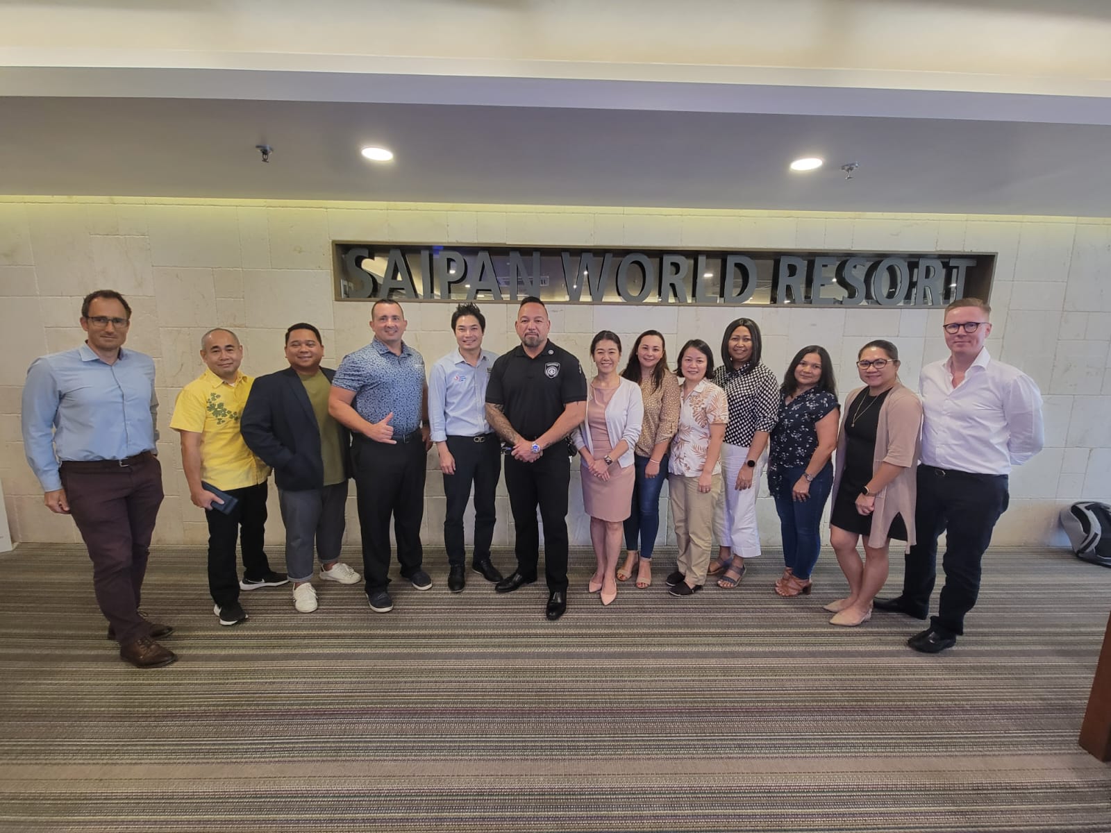 Hotel Association of the Northern Mariana Islands members pose for a photo with Corrections Commissioner Anthony Torres, center, following HANMI’s general membership meeting on Aug. 24 at Saipan World Resort.