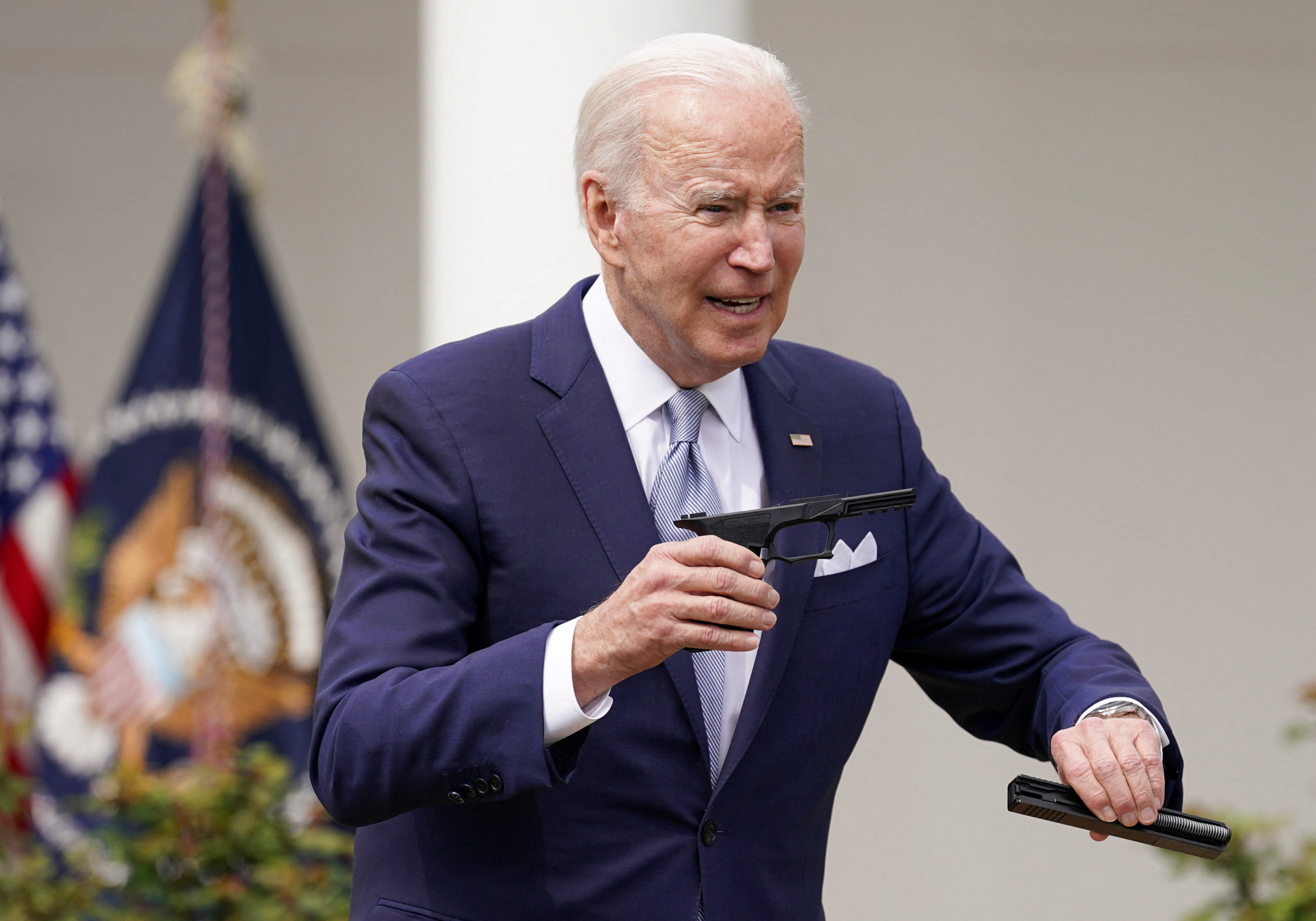 U.S. President Joe Biden holds up a ghost gun kit while announcing new measures by his administration to fight ghost gun crime at the White House in, Washington, U.S., April 11, 2022. REUTERS/Kevin Lamarque/File Photo