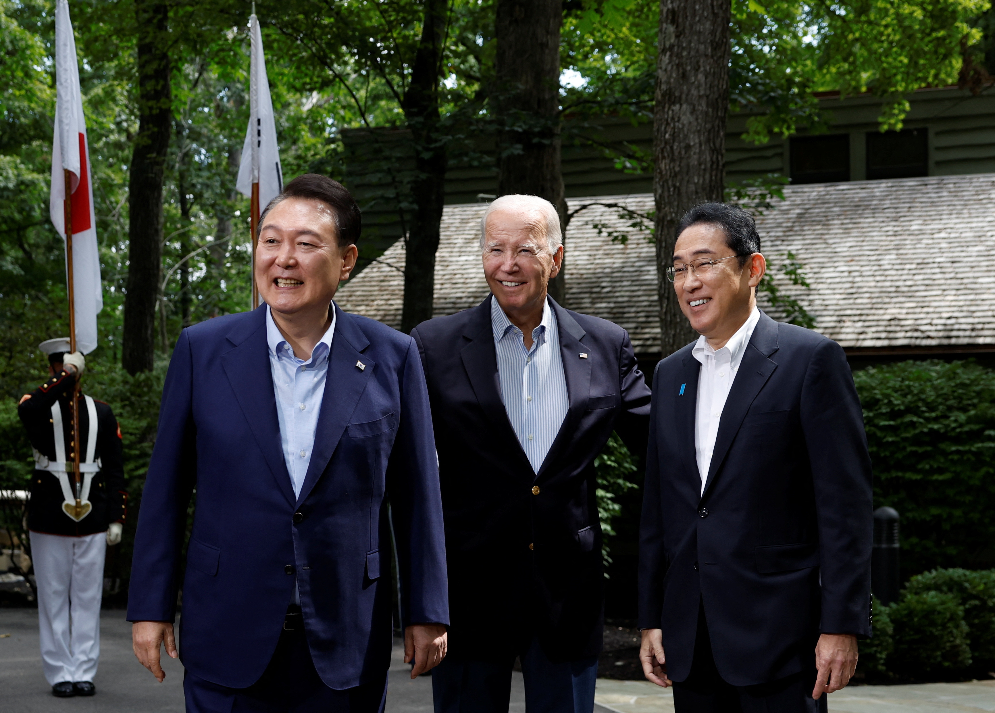 U.S. President Joe Biden, Japanese Prime Minister Fumio Kishida and South Korean President Yoon Suk Yeol pose during the trilateral summit at Camp David near Thurmont, Maryland, U.S., August 18, 2023. REUTERS/Evelyn Hockstein