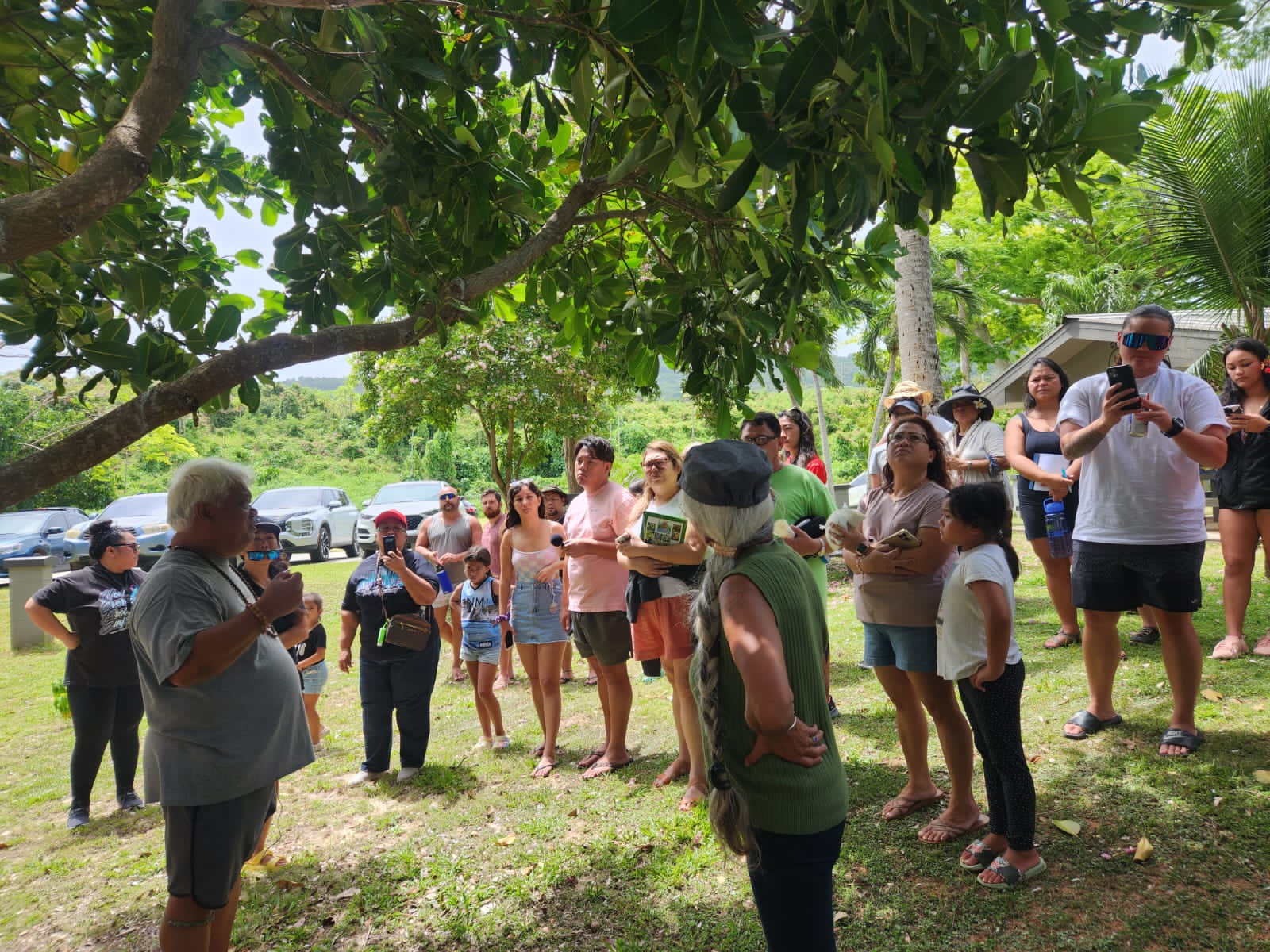 Donald Mendiola, left, lead participants at Paupau Beach in April of this year during the first Åmut Walk. He will collaborate with the Micronesia Climate Change Alliance and Our Common Wealth 670 for the second Åmut Walk on Sept. 3.