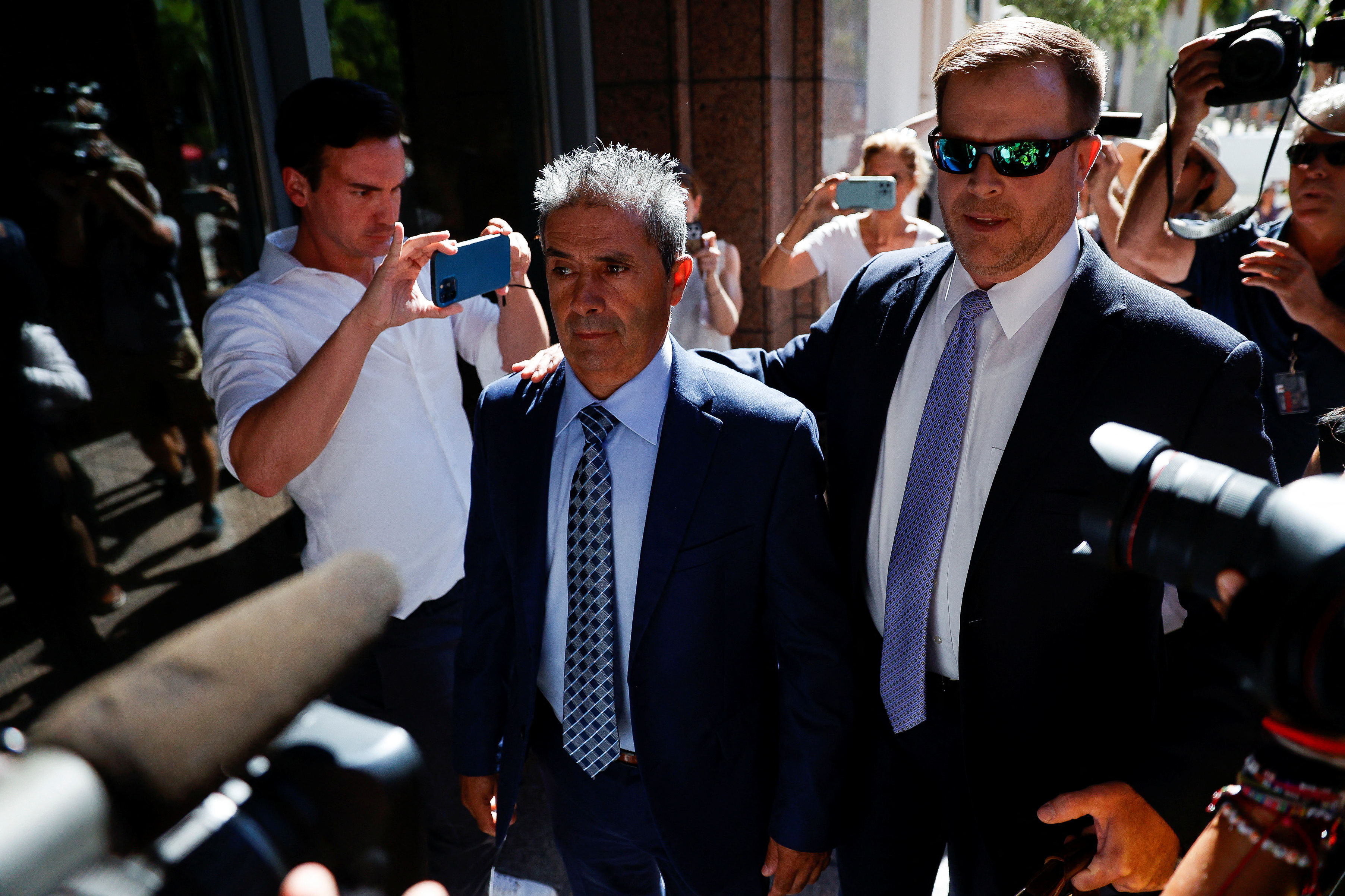 Carlos De Oliveira, the property manager of former U.S. President Donald Trump's Mar-a-Lago estate, arrives at federal court to face charges related to Trump's retention of classified documents at his Florida resort home, in Miami, Florida, U.S. July 31, 2023. REUTERS/Marco Bello