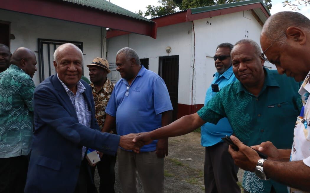 Sato Kilman with opposition supporters outside the Vanuatu Supre Court in Port Vila.
