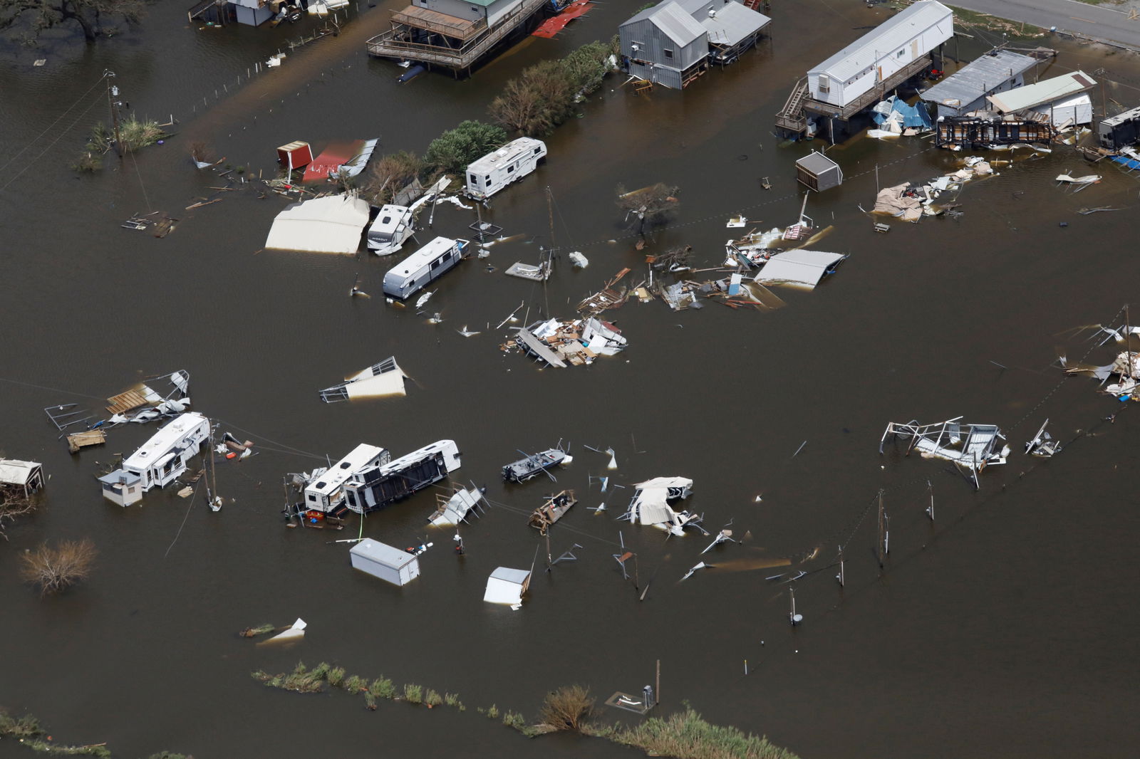 An aerial view shows destroyed houses in a flooded area after Hurricane Ida made landfall in Louisiana, in Montegut, Louisiana, U.S. August 31, 2021. REUTERS/Marco Bello/File Photo