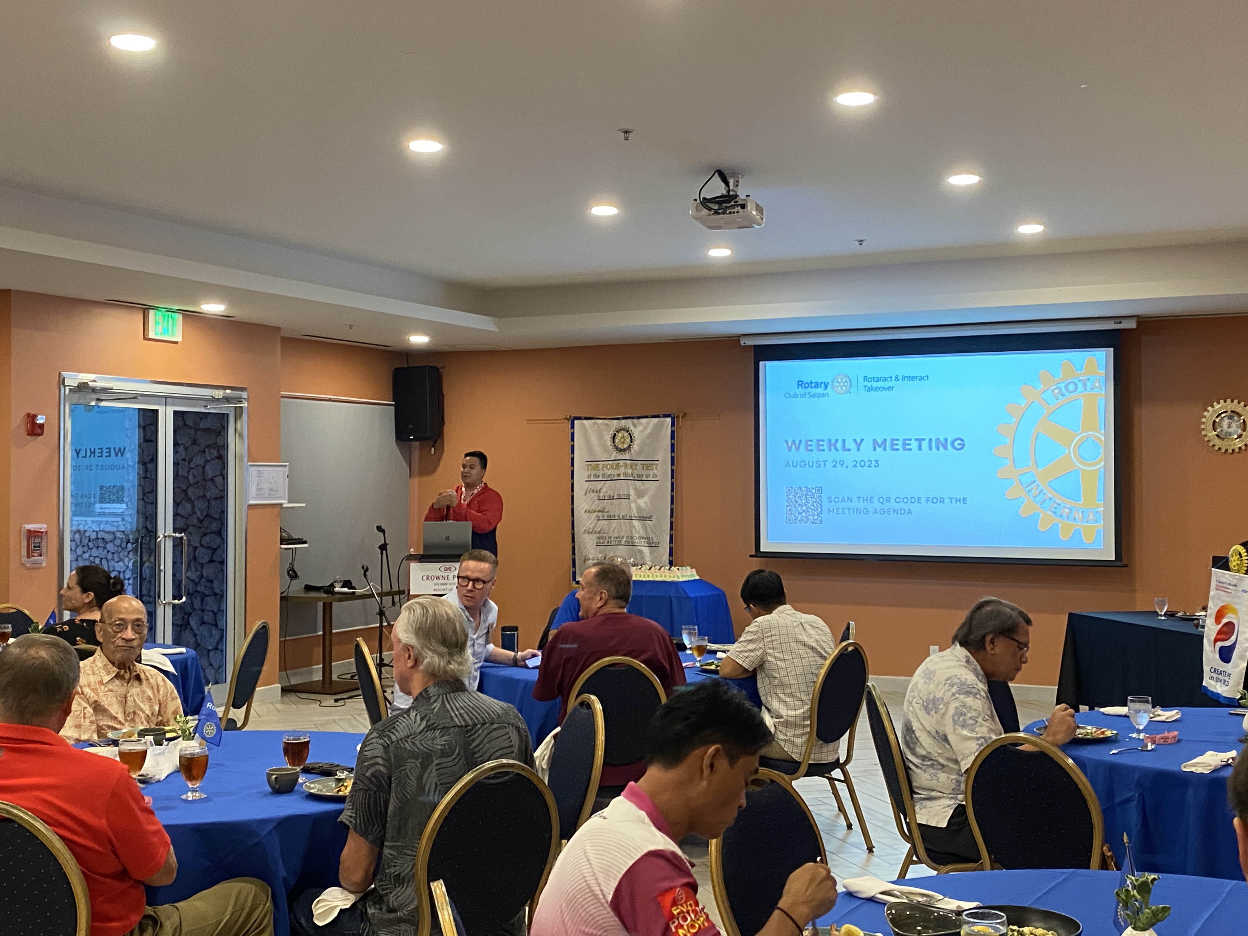 Rotaract Club of Saipan President Richard Baleares, standing background, presides over a meeting of the Rotary Club of Saipan at Crowne Plaza on Tuesday, Aug. 29.