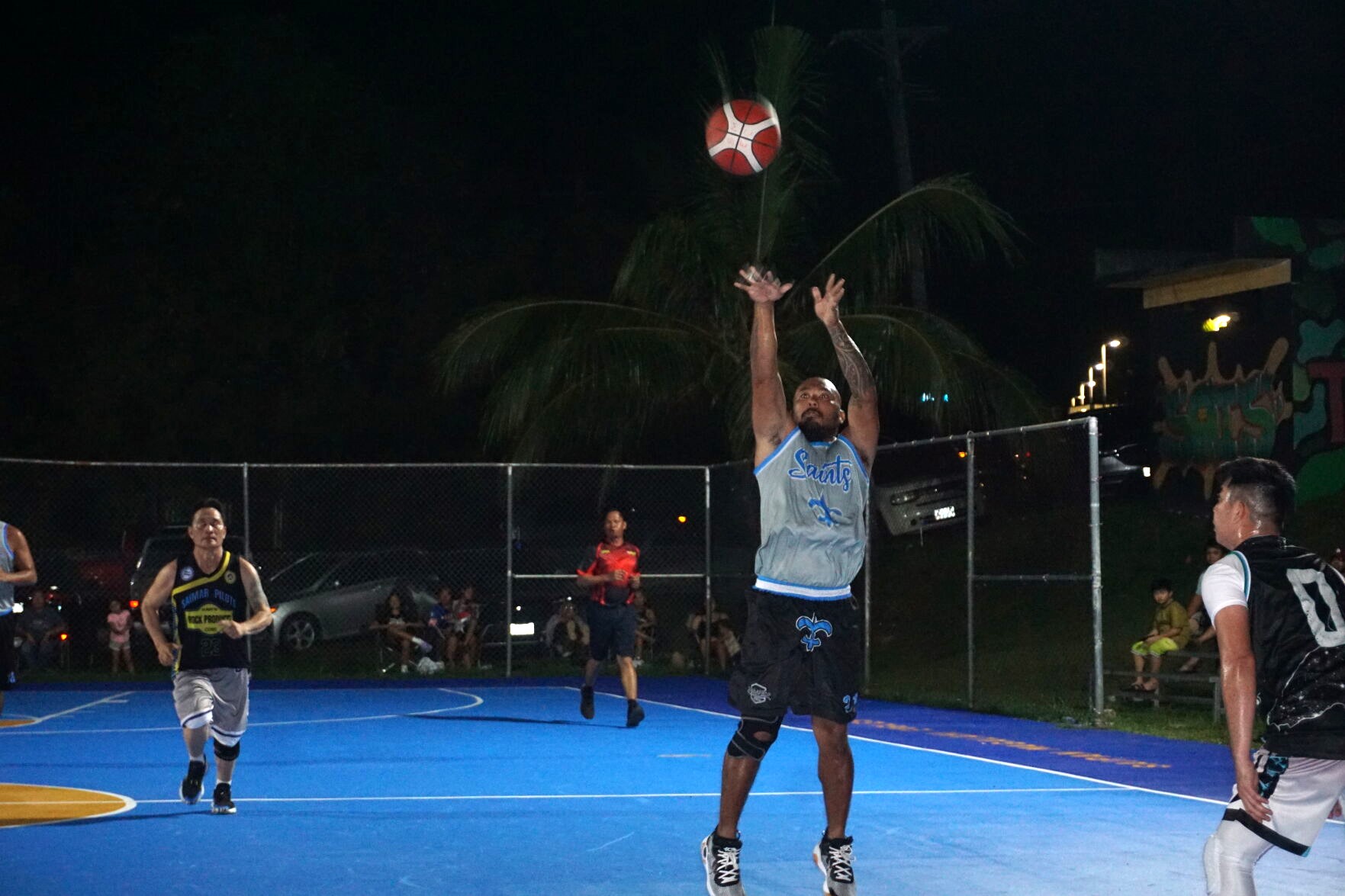 The CK Saints’ Zack Tudela pulls up for the uncontested three-point shot during an open division game of the 2023 Saipan MagaLahi Eagles Club Invitational Basketball League on Tuesday at the Gualo Rai basketball court.