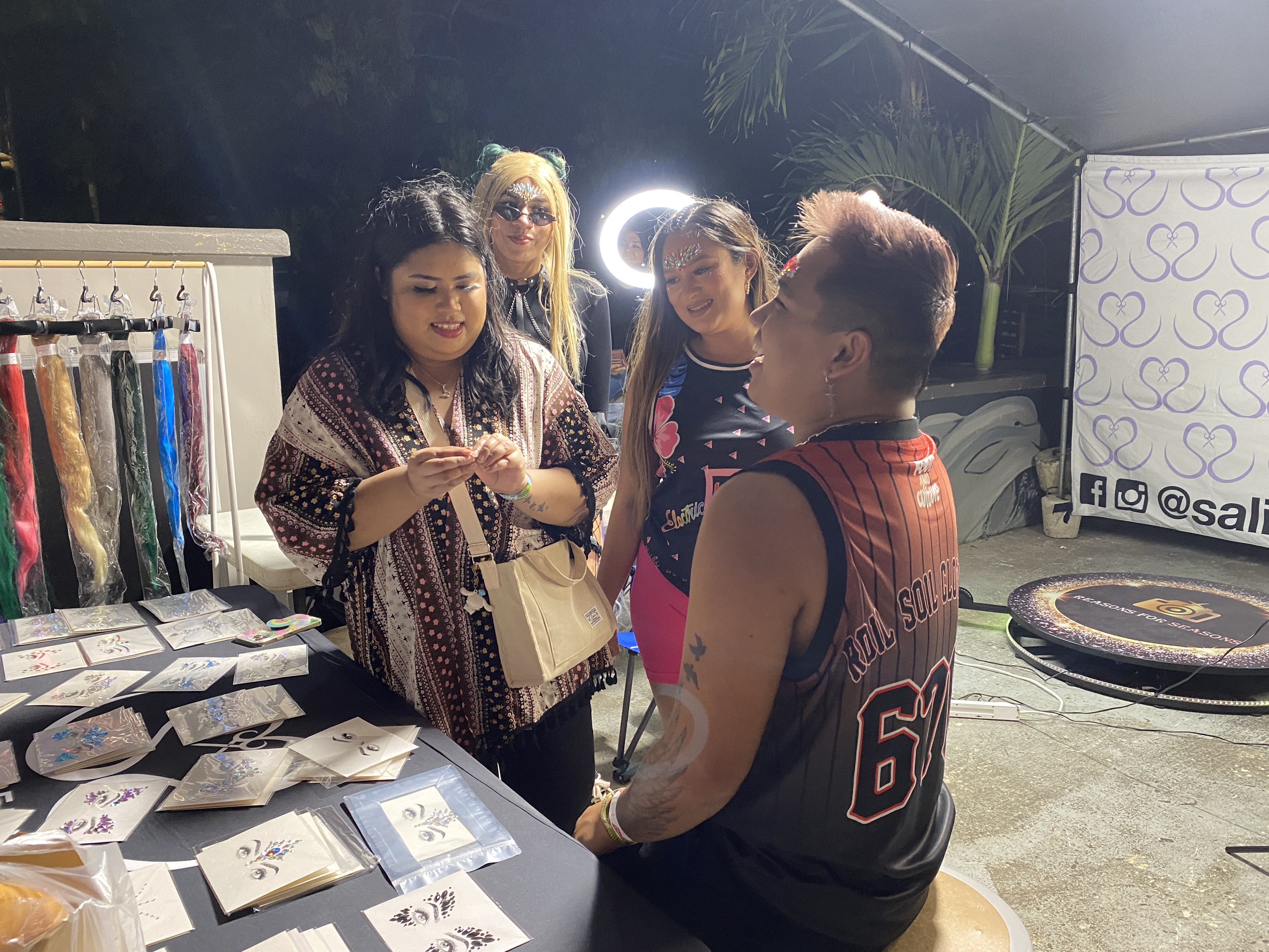 NMTech Cohort members apply facial jewelry at EIF Saipan.
