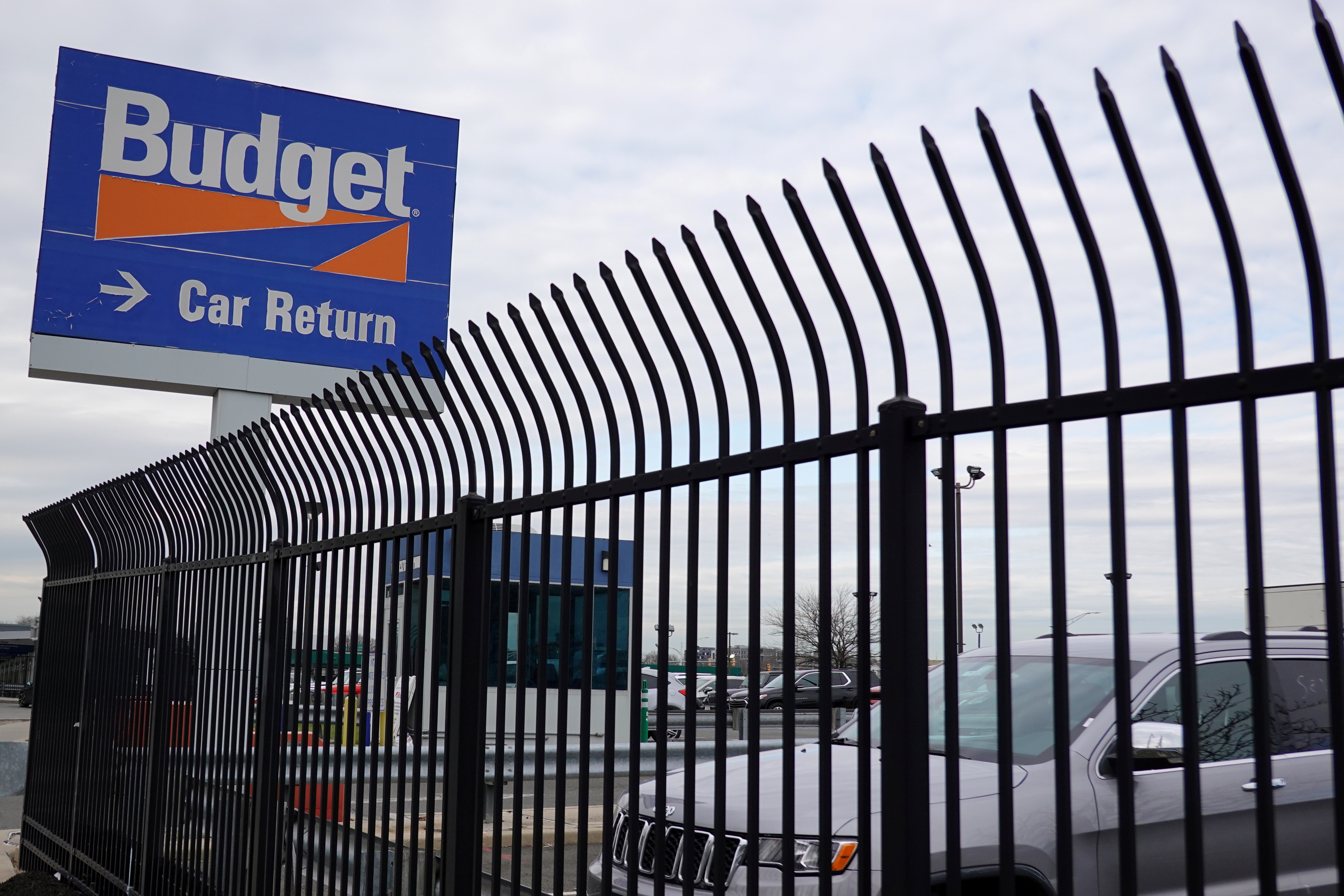 Budget rental car signage is seen at John F. Kennedy International Airport in Queens, New York City, U.S., March 30, 2022. REUTERS/Andrew Kelly/file photo