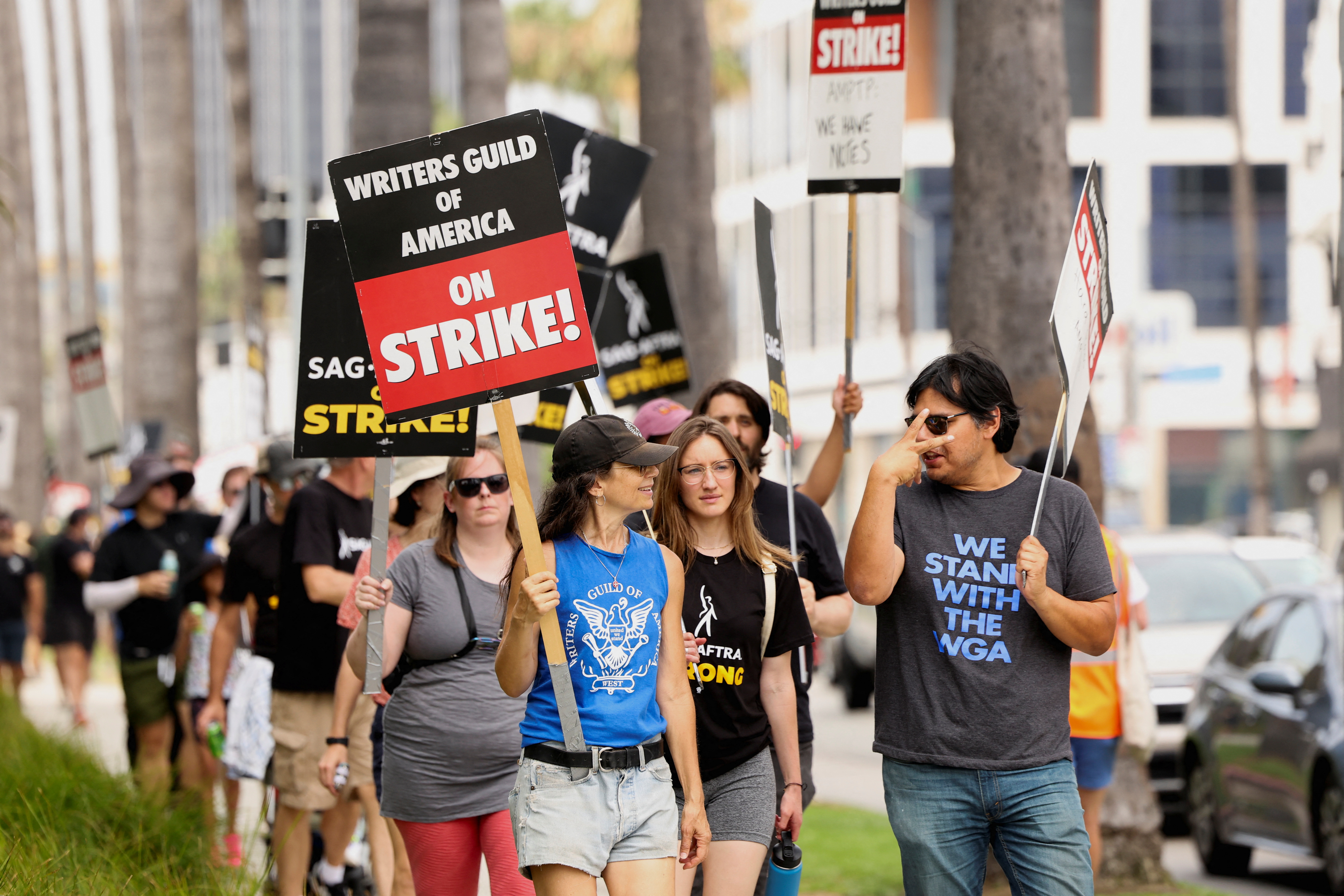 SAG-AFTRA actors and Writers Guild of America (WGA) writers walk the picket line during their ongoing strike outside Netflix, in Los Angeles, California, U.S., July 31, 2023. REUTERS/Mario Anzuoni