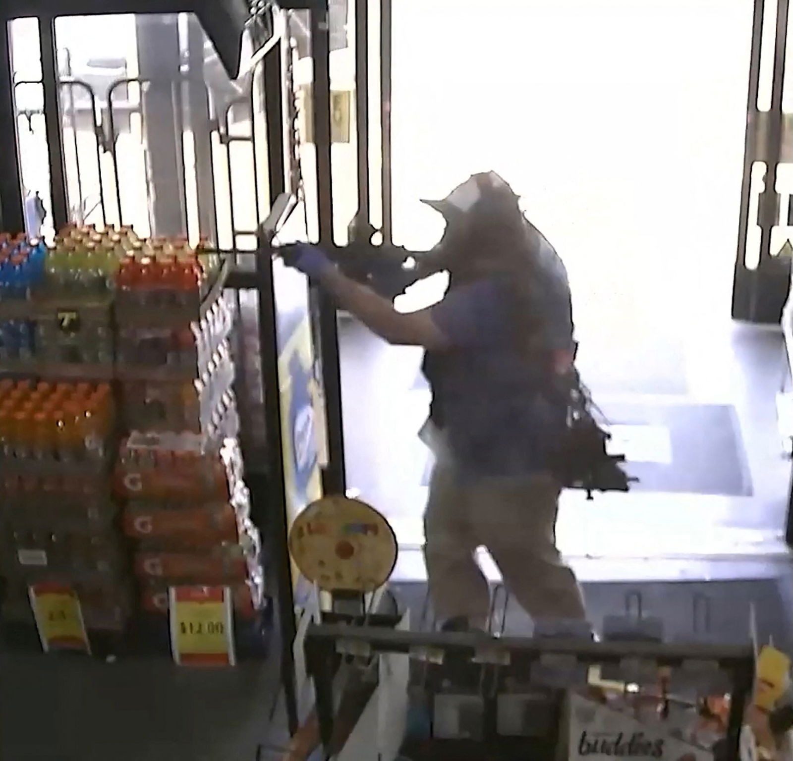 Ryan Christopher Palmeter, 21, is shown in a still image from surveillance video holding a rifle at a Dollar Store after being identified by Sheriff T.K. Waters as the white man who killed three Black people before shooting himself August 26, 2023 in what local law enforcement described as a racially motivated crime in Jacksonville, Florida, U.S. Jacksonville Sheriff’s Office/Handout via REUTERS.