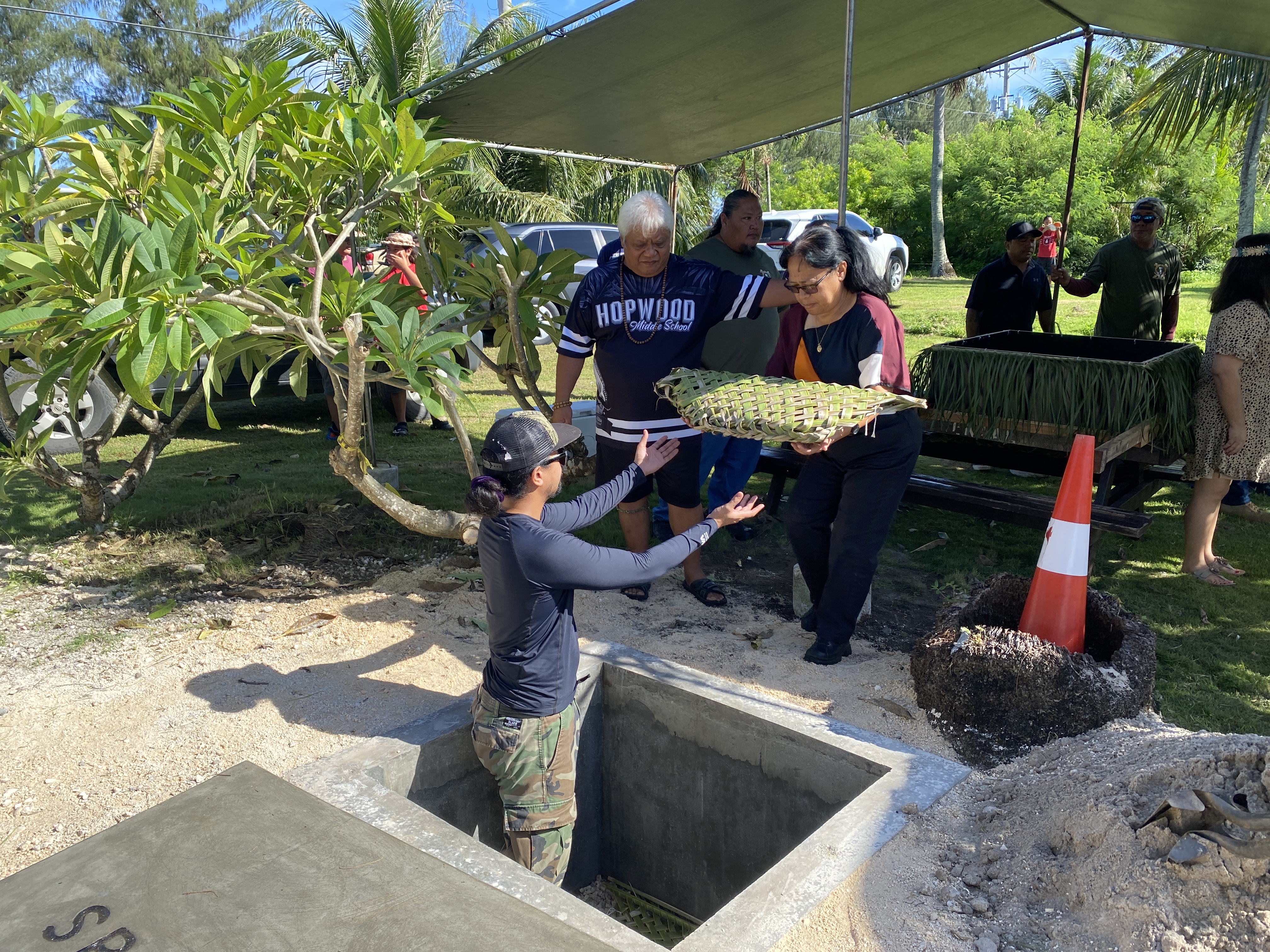 Department of Community and Cultural Affairs Secretary Maggie Sablan brings the remains of ancestral Chamorros to their reinterment site in Chalan Laulau on Aug. 18.