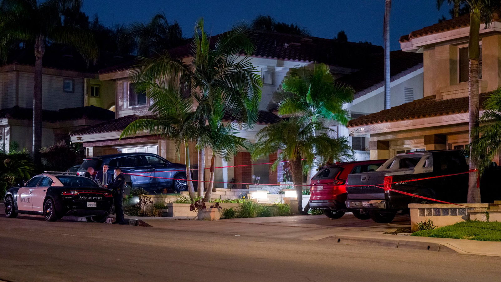 Red crime scene tape surrounds a home, right, in the 8500 block of E. Canyon Vista Drive in Anaheim on Thursday, Aug. 3, 2023, where Orange County Superior Court Judge Jeffrey Ferguson was taken into custody by Anaheim police after a shooting death of his wife, according to multiple sources. (Leonard Ortiz/Orange County Register/SCNG/TNS)