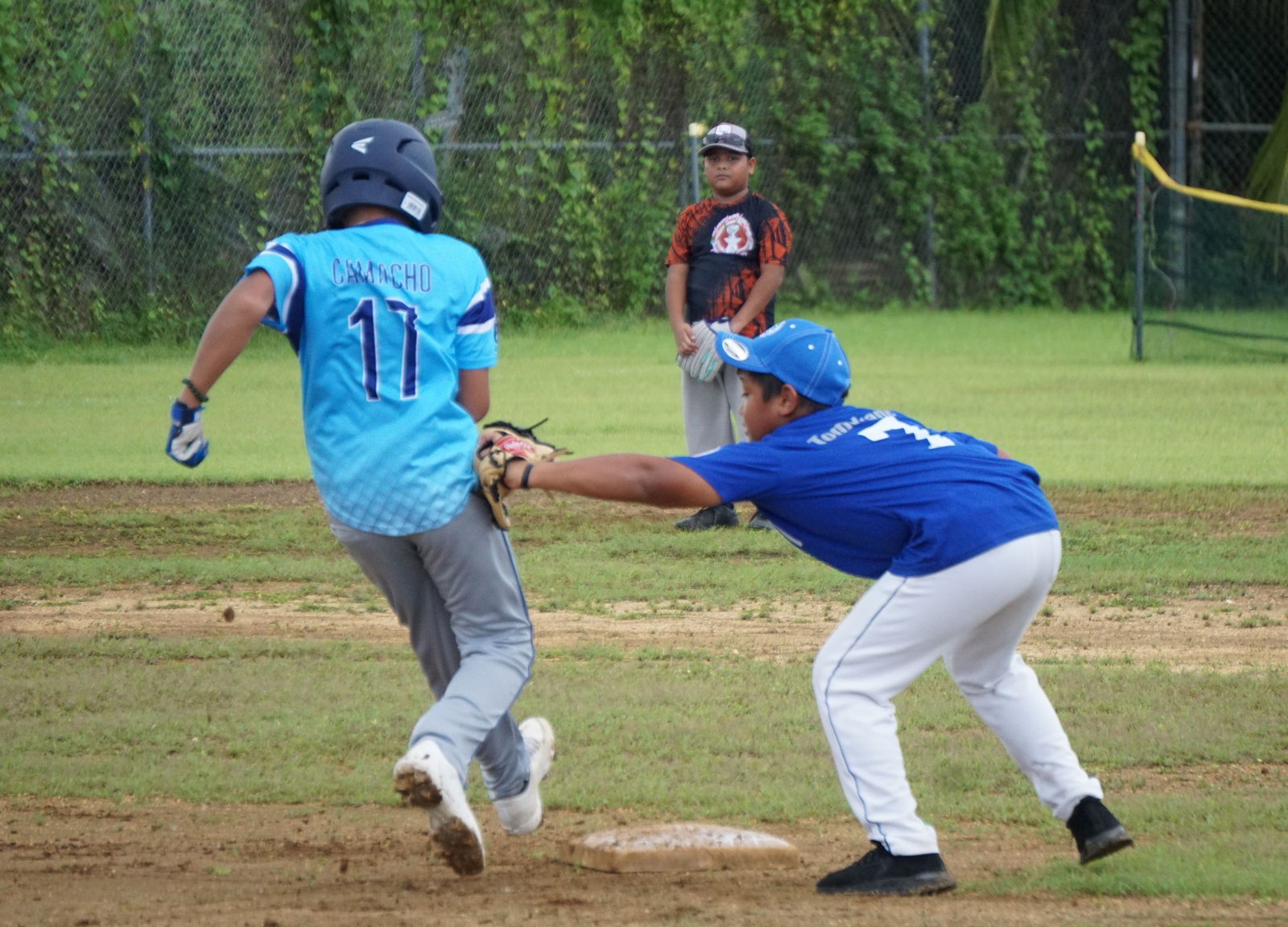 The Twins' Myrhus Tomokane tags out a runner during a Saipan Baseball League U12 Tournament game Saturday at the Miguel "Tan Ge" Pangelinan Baseball Field.