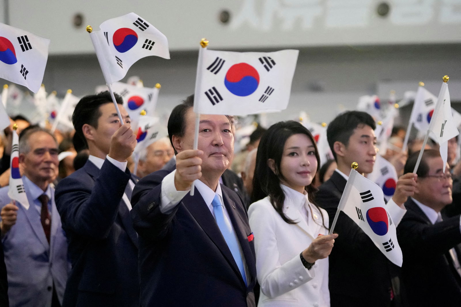 South Korean President Yoon Suk Yeol and his wife Kim Keon Hee wave the national flag during a ceremony to celebrate the 78th anniversary of the Korean Liberation Day from Japanese colonial rule in 1945, in Seoul, South Korea, Tuesday, Aug. 15, 2023. Lee Jin-man/Pool via REUTERS/File Photo