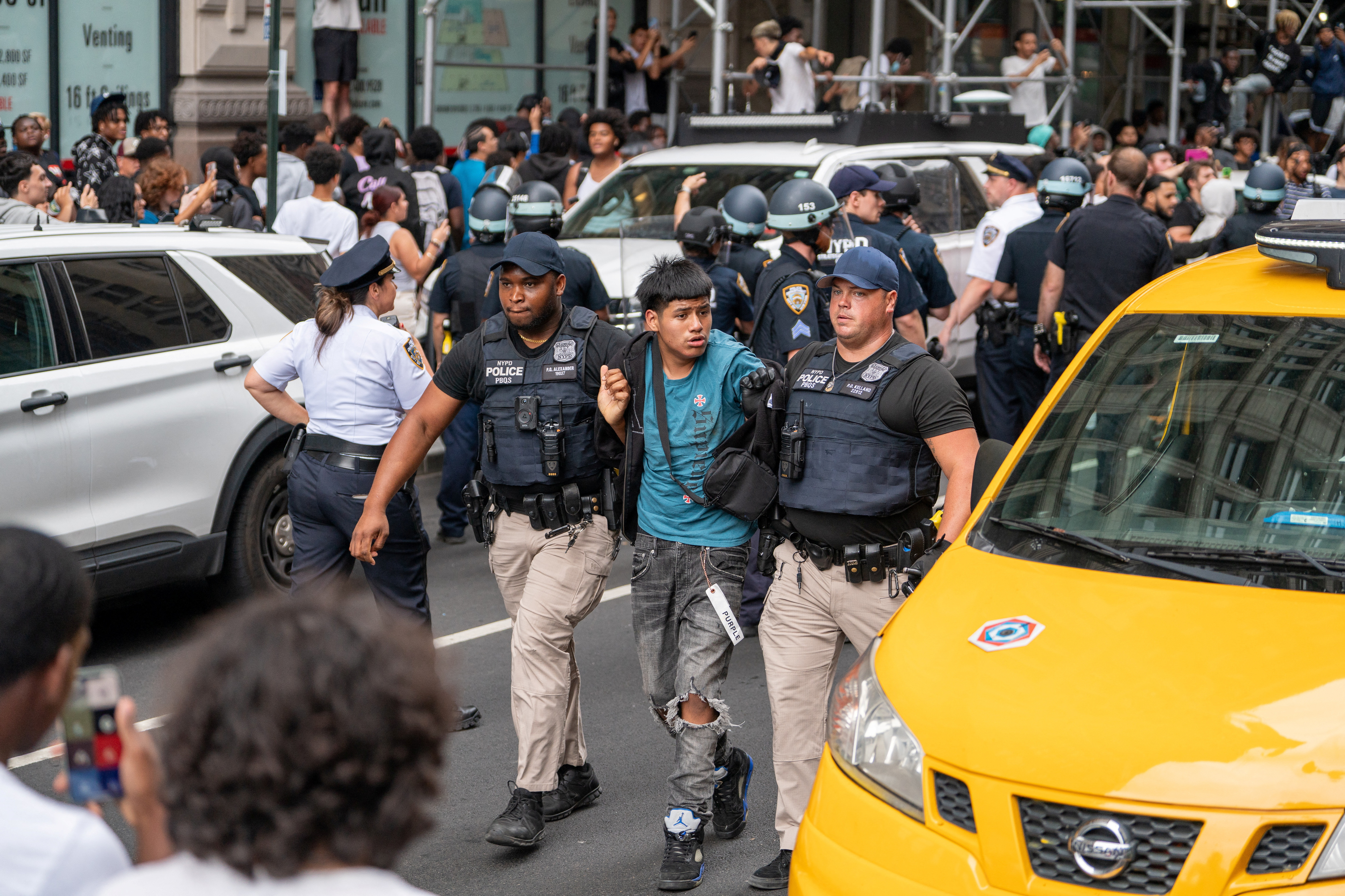 Police officers detain a person after popular live streamer Kai Cenat announced a "giveaway" event that grew chaotic, prompting police officers to respond and disperse the crowd at Union Square and the surrounding streets, in New York City, U.S. August 4, 2023. REUTERS/David 'Dee' Delgado