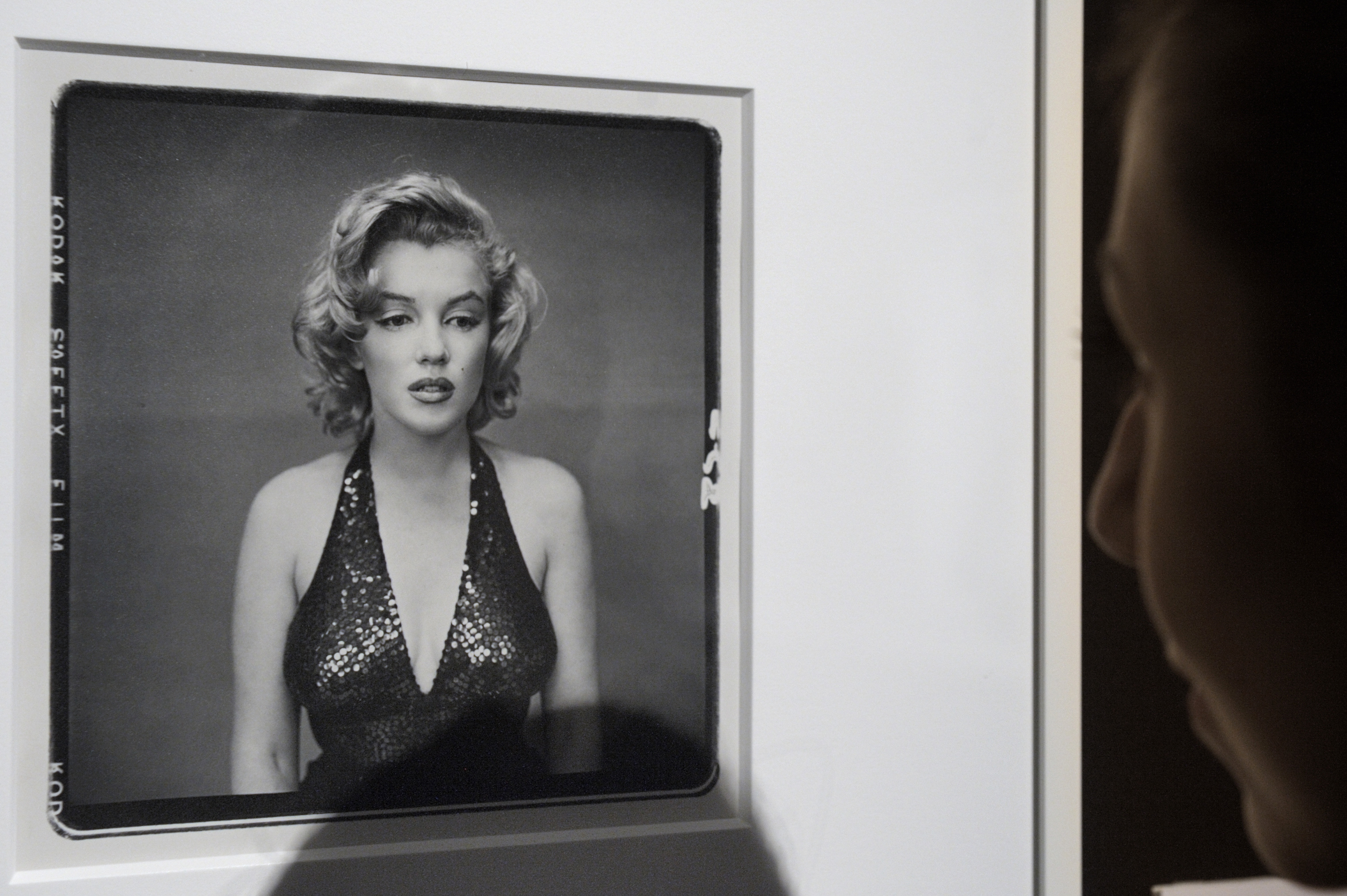 A visitor looks at the picture 'Marilyn Monroe, Actress, New York City, May 6, 1957' by photographer Richard Avedon (1923-2004) displayed at Christie's auction house in Paris November 18, 2010. 