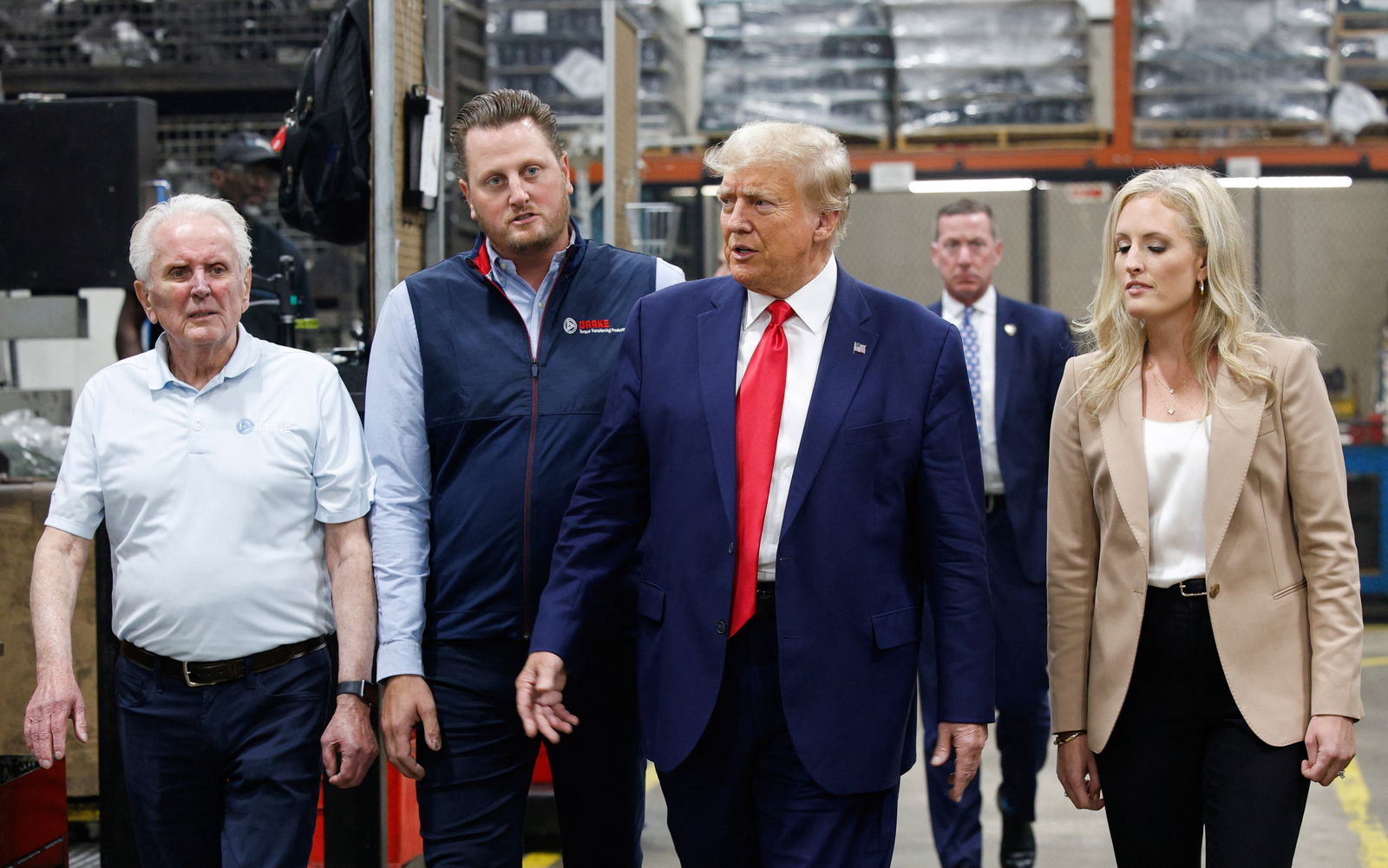 Former U.S. President and Republican presidential candidate Donald Trump walks on the day he addresses auto workers as he skips the second GOP debate, in Clinton Township, Michigan, U.S., September 27, 2023. 