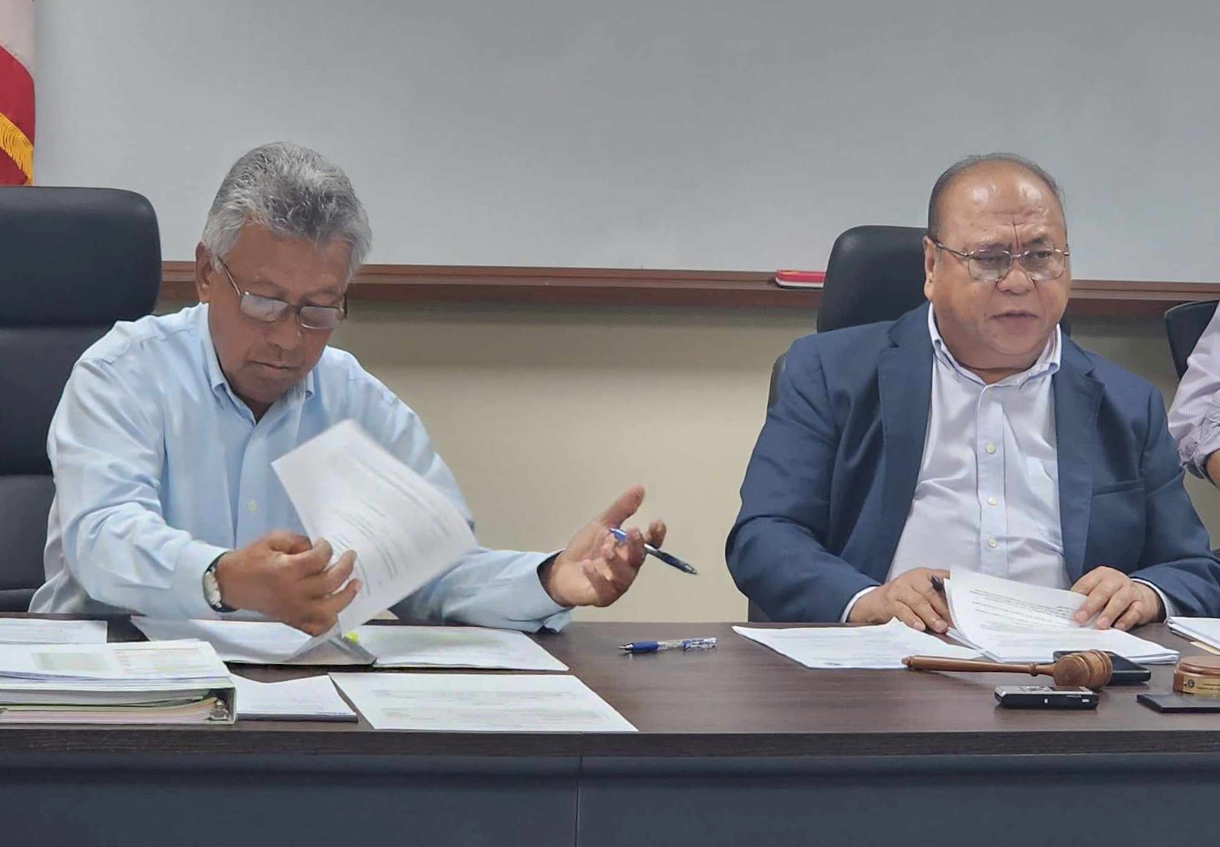 Commonwealth Casino Commission Chairman Edward C. Deleon Guerrero, right, and member Mario Taitano attend a regular meeting in the commission's conference room in Gualo Rai.