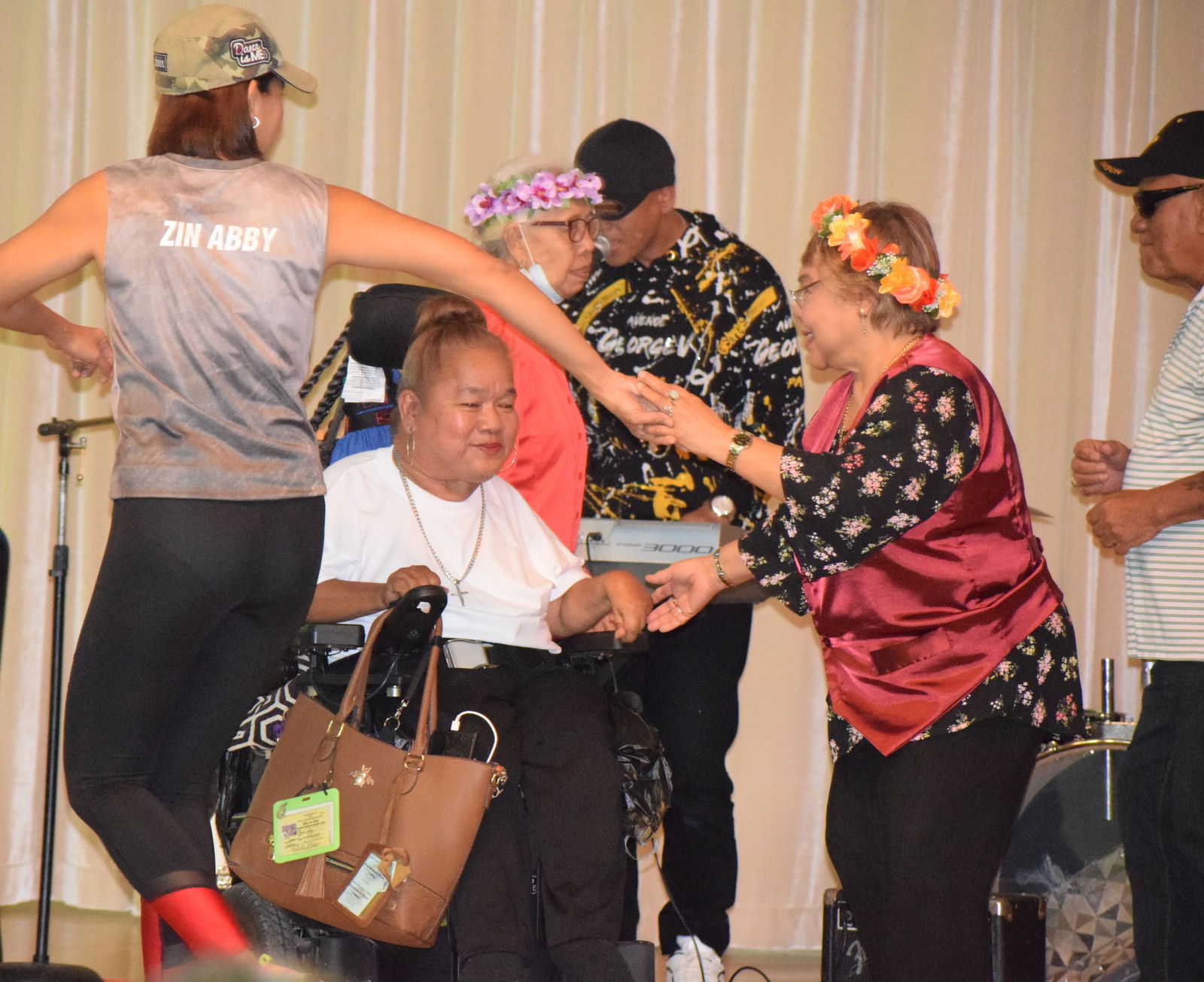 Senior citizens join Cynthia Attao in a dance number.