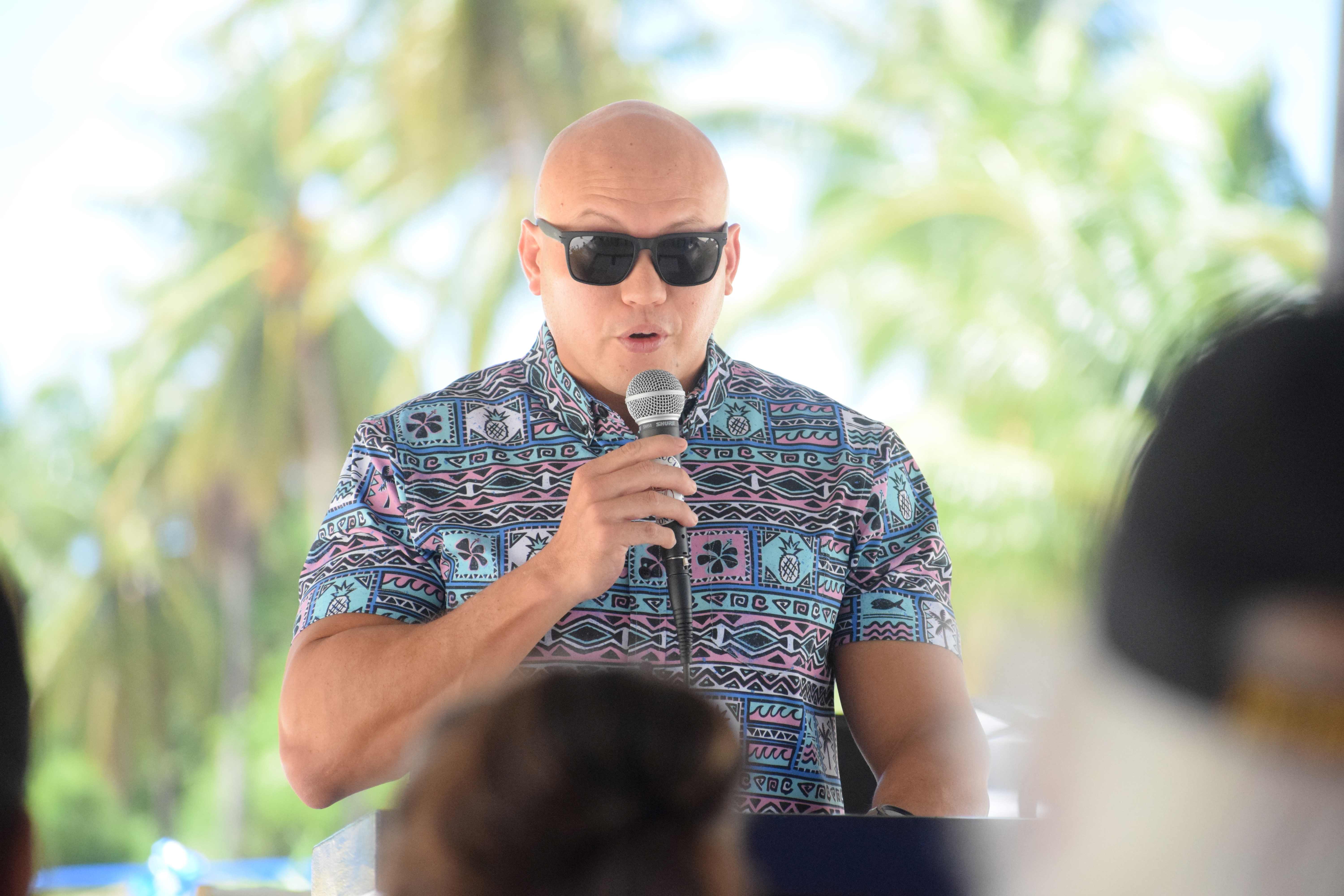 Port Operators and Users Committee Chairman Jose Quan speaks during the ribbon-cutting ceremony on Industrial Drive.