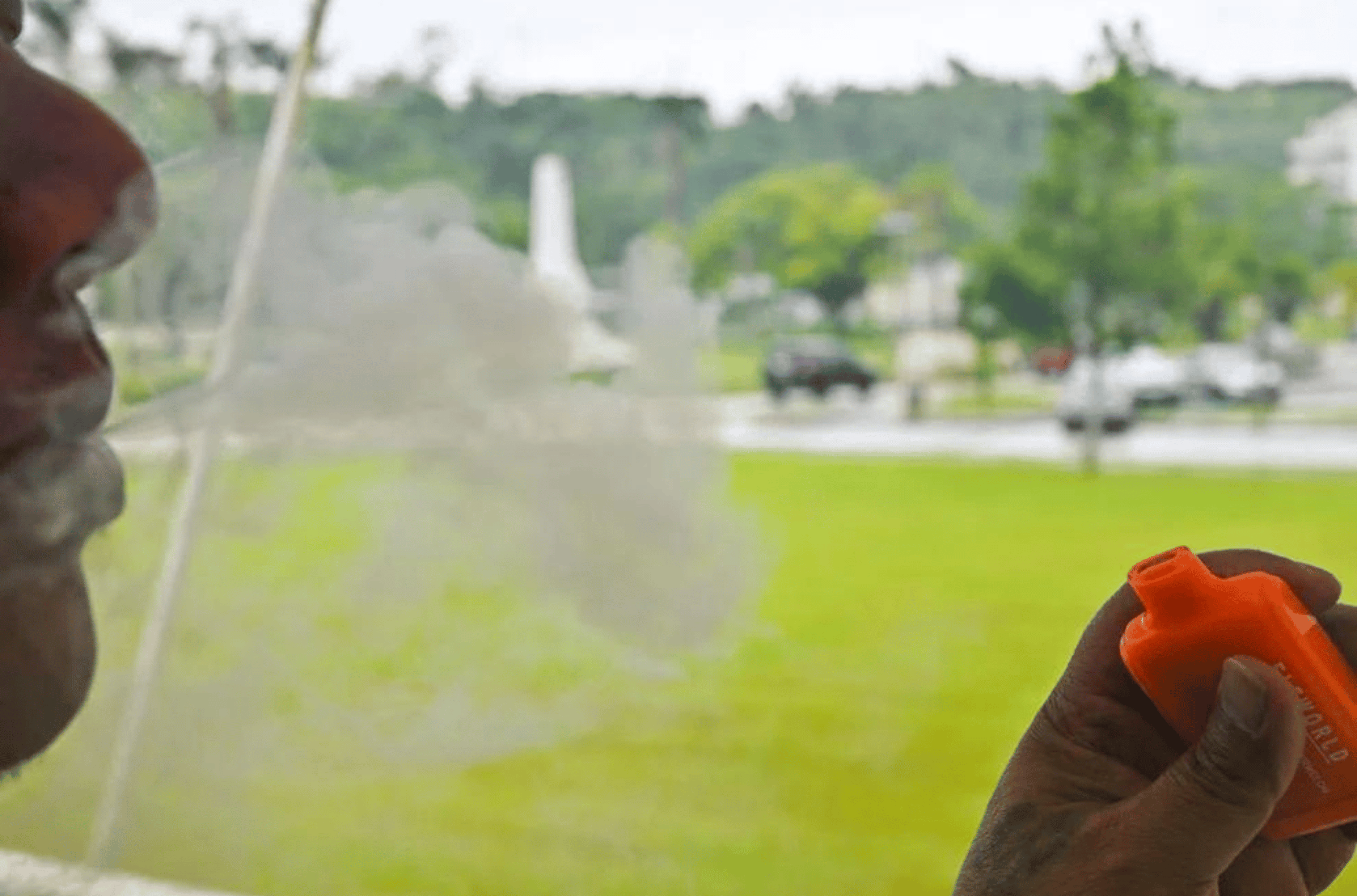 A person blows a cloud of smoke as he vapes Monday Aug. 14, 2023, in Hagåtña.