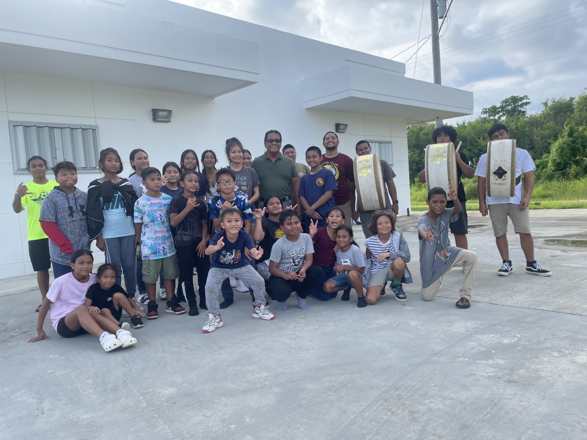 Saipan Mayor RB Camacho poses for a photo with members of the Saipan Awaodori Team.