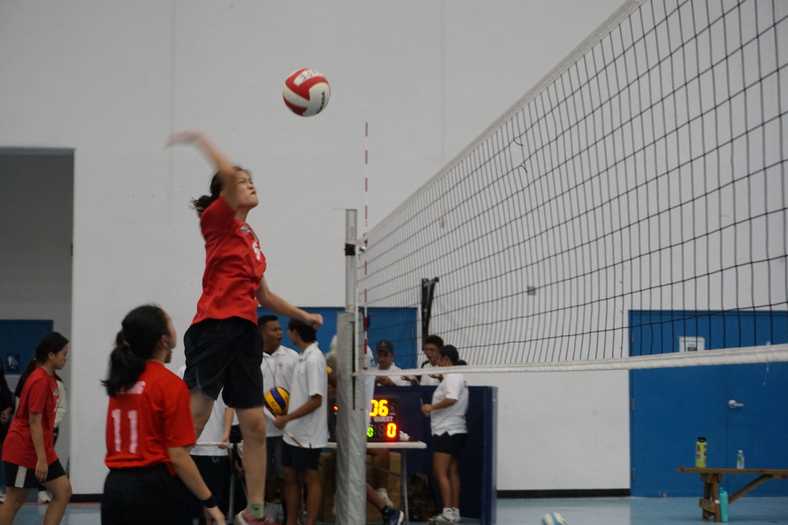 Agape Christian School's Ruishi “Mary” Zhu takes off for the spike finish during a girls high school division game of the NMIVA-PSS Interscholastic Volleyball League at the Marianas High School gym.