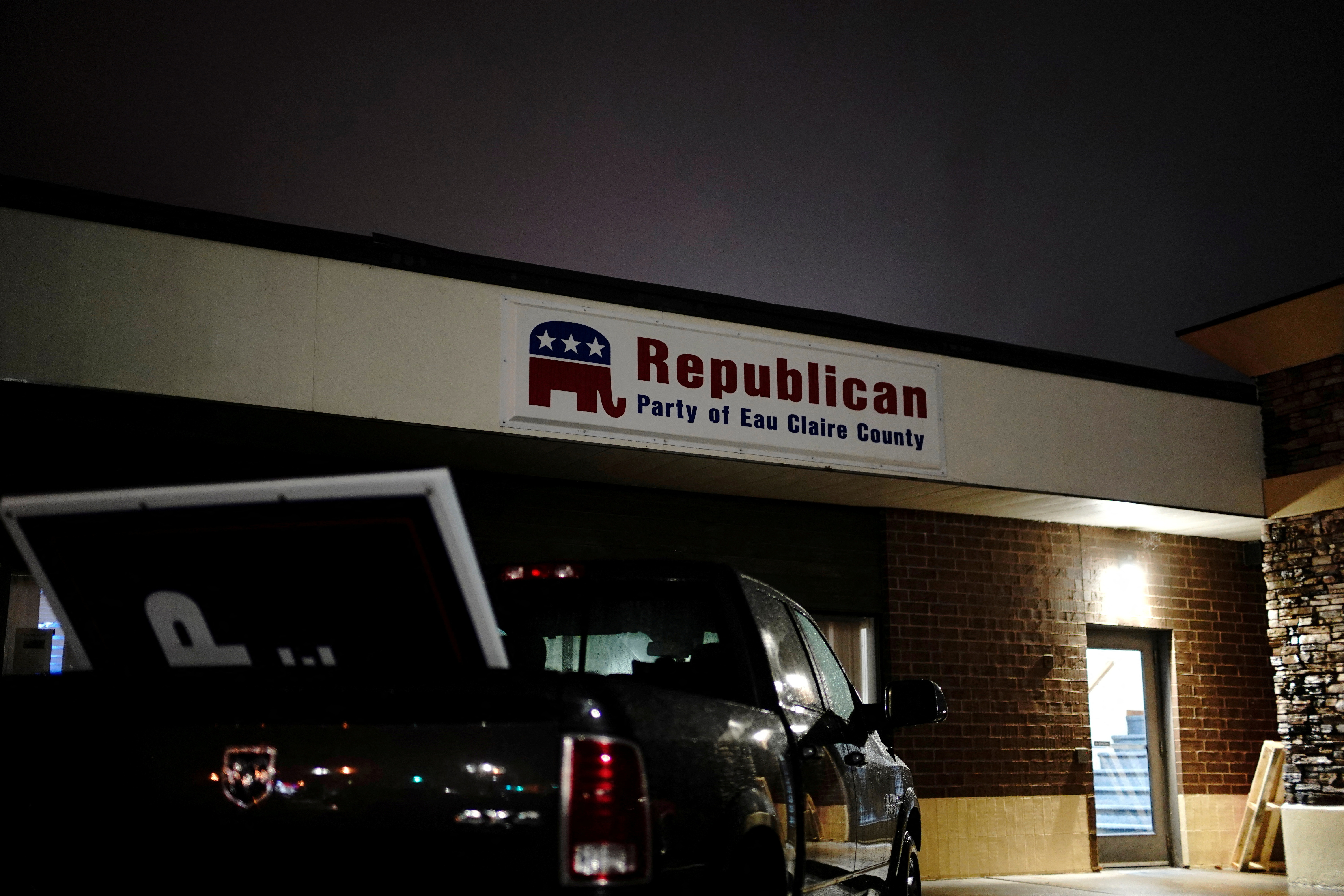 An oversize Trump sign is seen in the back of a pickup truck parked outside the Republican Party of Eau Claire County office in Altoona, Wisconsin, U.S., October 22, 2020. 