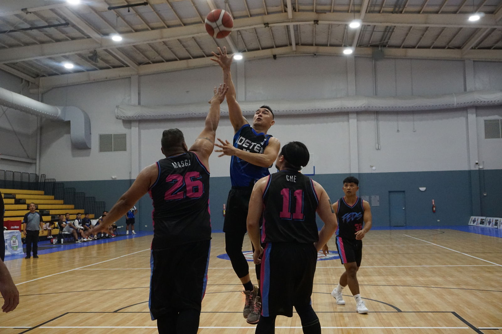 Joeten's Alex Lauron takes the floater against two Federal defenders in the opening game of the 2023 R&J Wine and Liquor Inter-Government/Business League on Monday at Ada gym.