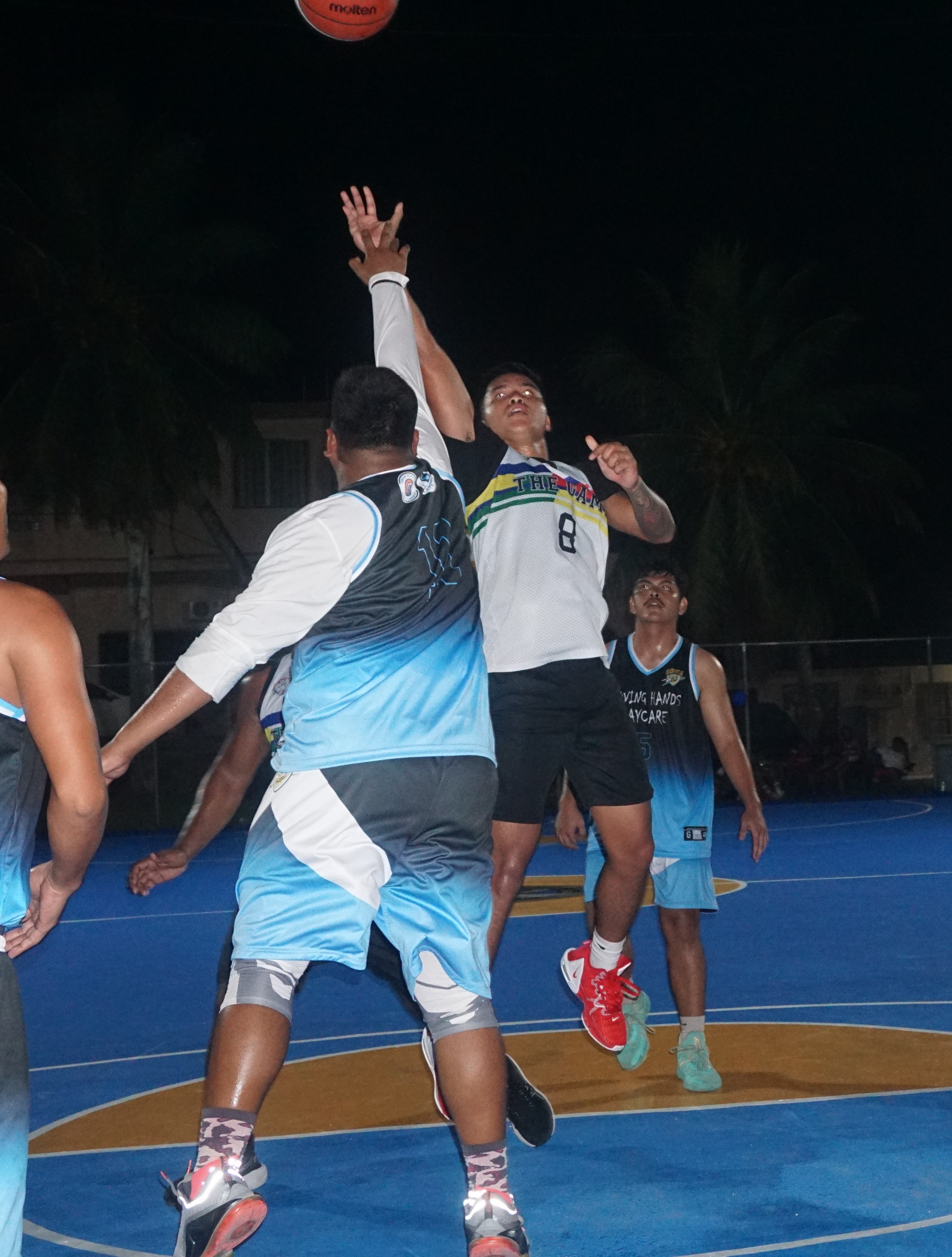 The Game-Eats Easy's Francisco Mizutani attempts a floater over a defender during an open division game of the 2023 Saipan Magalahi Eagles Club Invitational Basketball League  at the Gualo Rai basketball court.