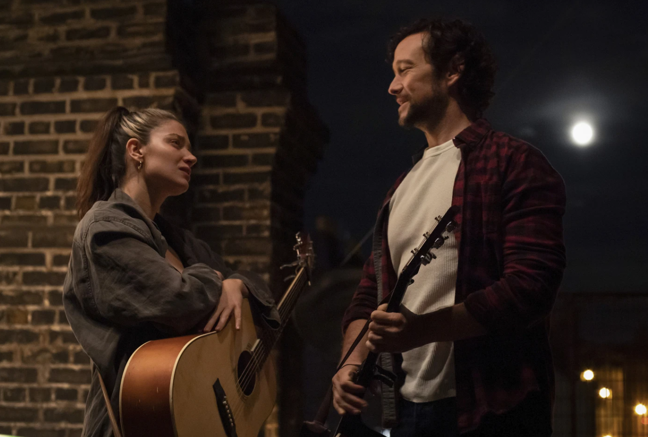 Eve Hewson, left, and Joseph Gordon-Levitt in a scene from “Flore and Son.”