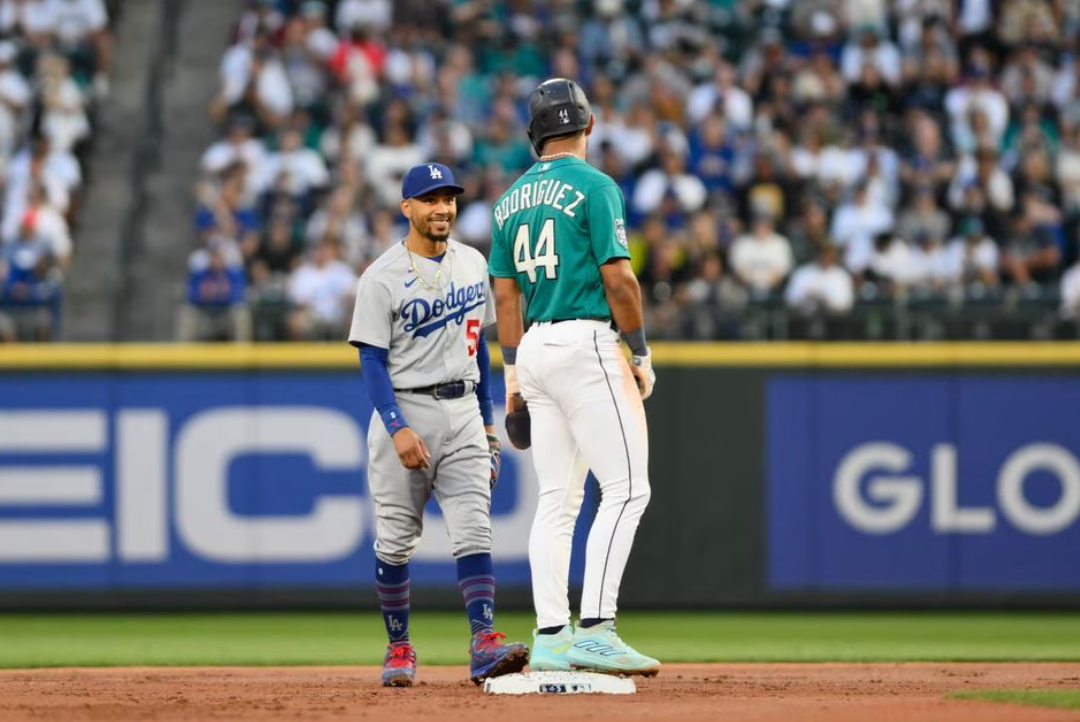 Los Angeles Dodgers second baseman Mookie Betts (50) and Seattle Mariners center fielder Julio Rodriguez (44) talk at second base during the first inning at T-Mobile Park in Seattle, Washington, Sept. 16, 2023.