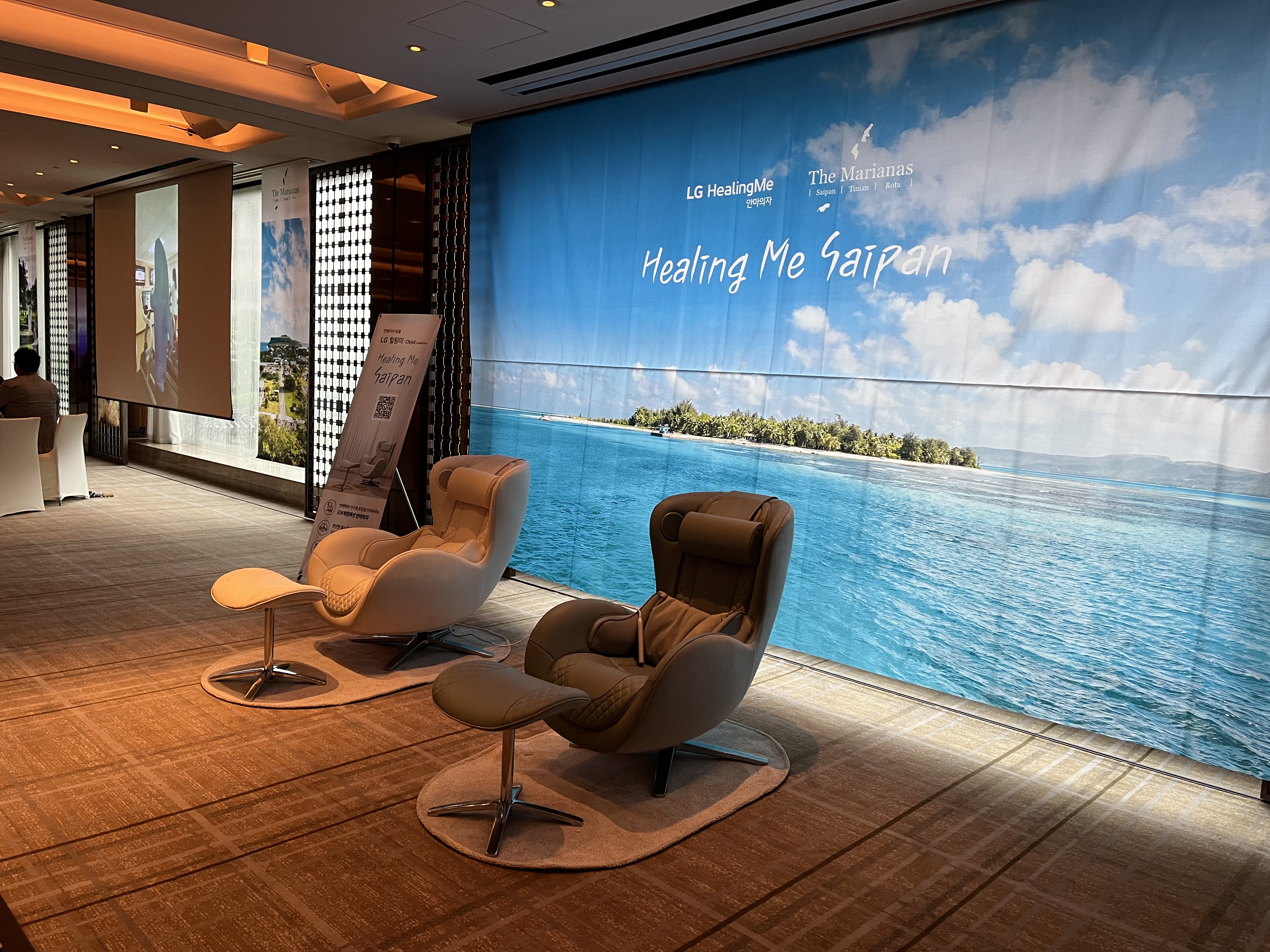 The LG Healing Me Saipan Massage Chair is featured at the booth of the Marianas Visitors Authority during the MVA Seoul-Busan Roadshow in August 2023 in South Korea. LG Electronics and the MVA also collaborated on the “Saipan Healing Trip” consumer event in Summer 2023 to promote both the product and the Marianas travel destination.