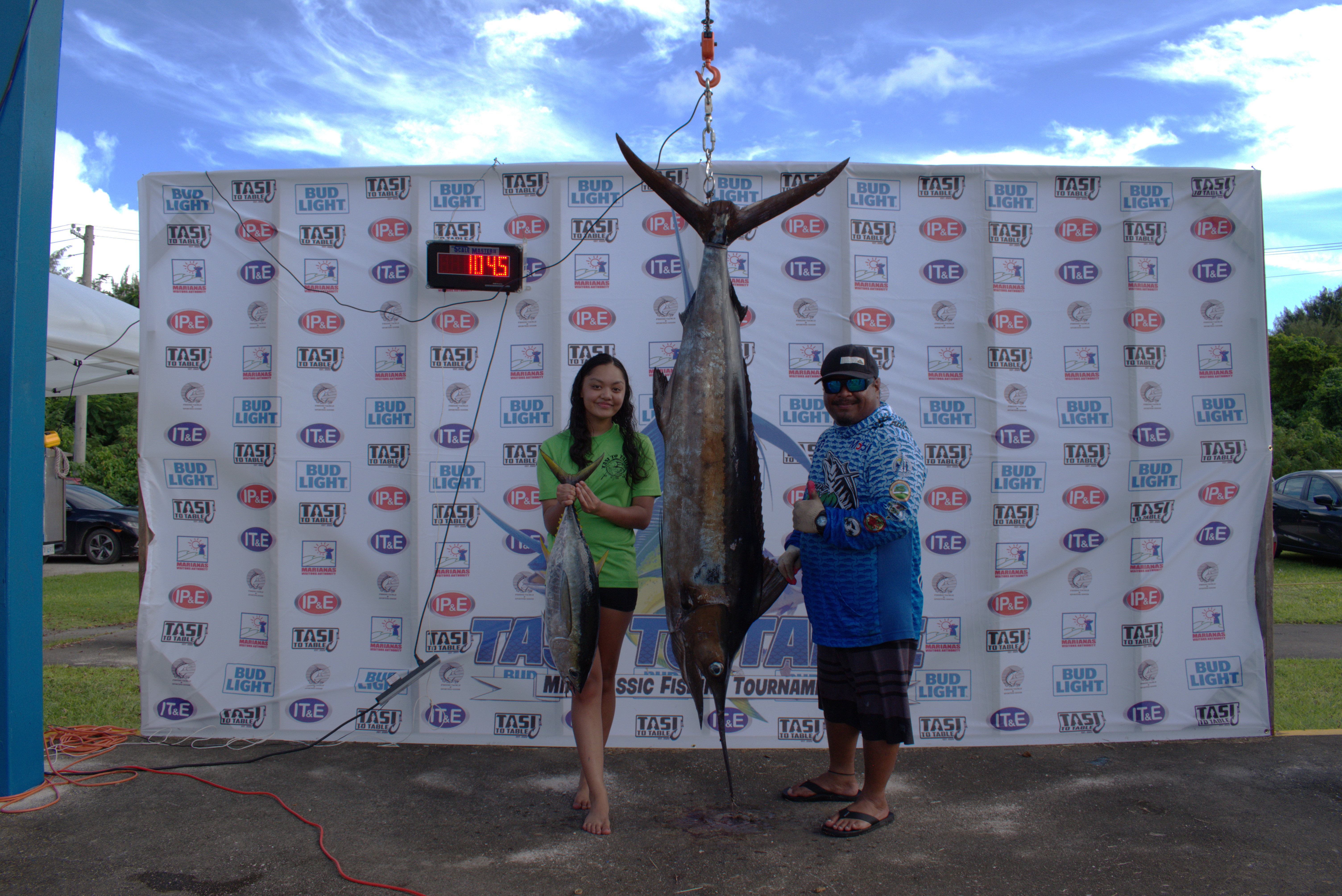 Carmelita II's Carmelita Castro and Jeremy Koshiro pose with their catch — a 104.5-pound marlin and a 15.6-pound yellowfin. With a total weight of 120.10 pounds, Carmelita II topped the 2nd Annual Tasi To Table Mix Classic on Sept. 23, 2023 at Smiling Cove Marina.