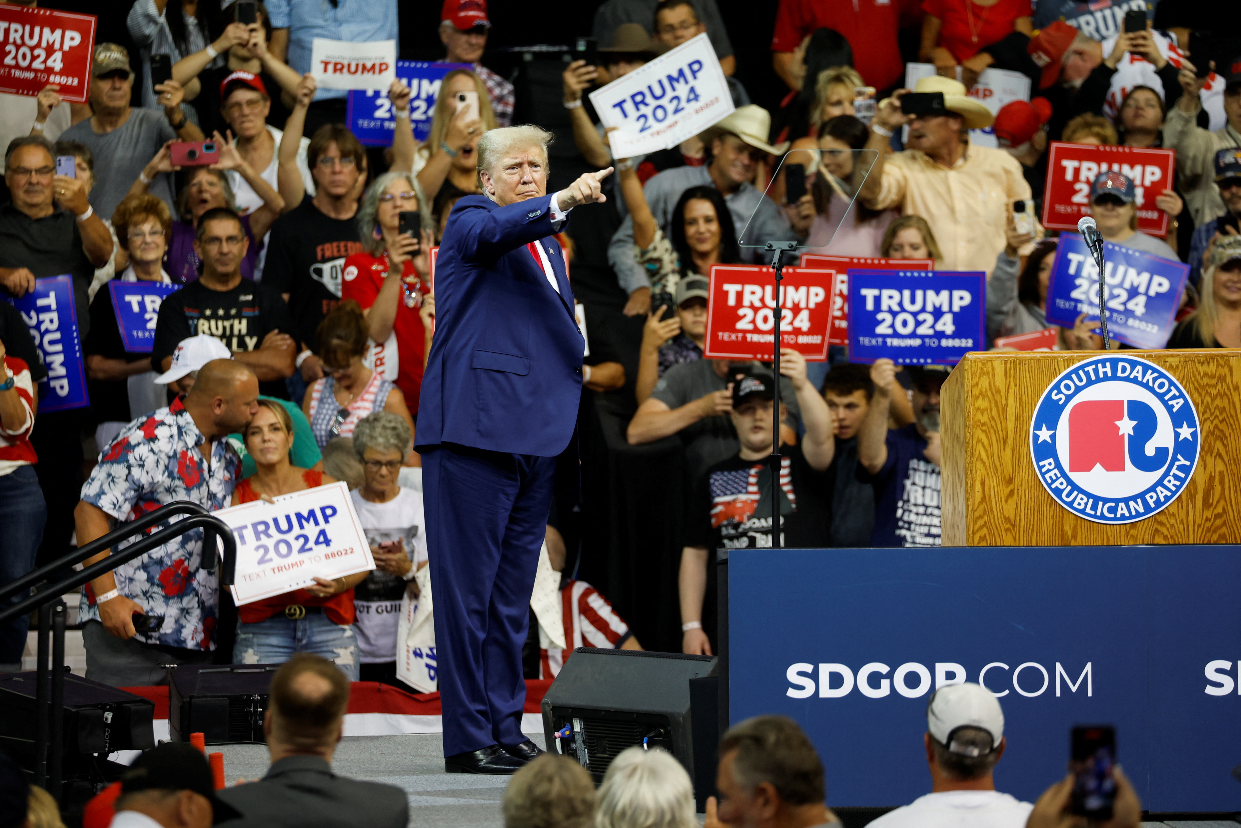 Former U.S. President and Republican presidential candidate Donald Trump gestures towards his supporters at a South Dakota Republican party rally in Rapid City, South Dakota, U.S. September 8, 2023. REUTERS/Jonathan Ernst