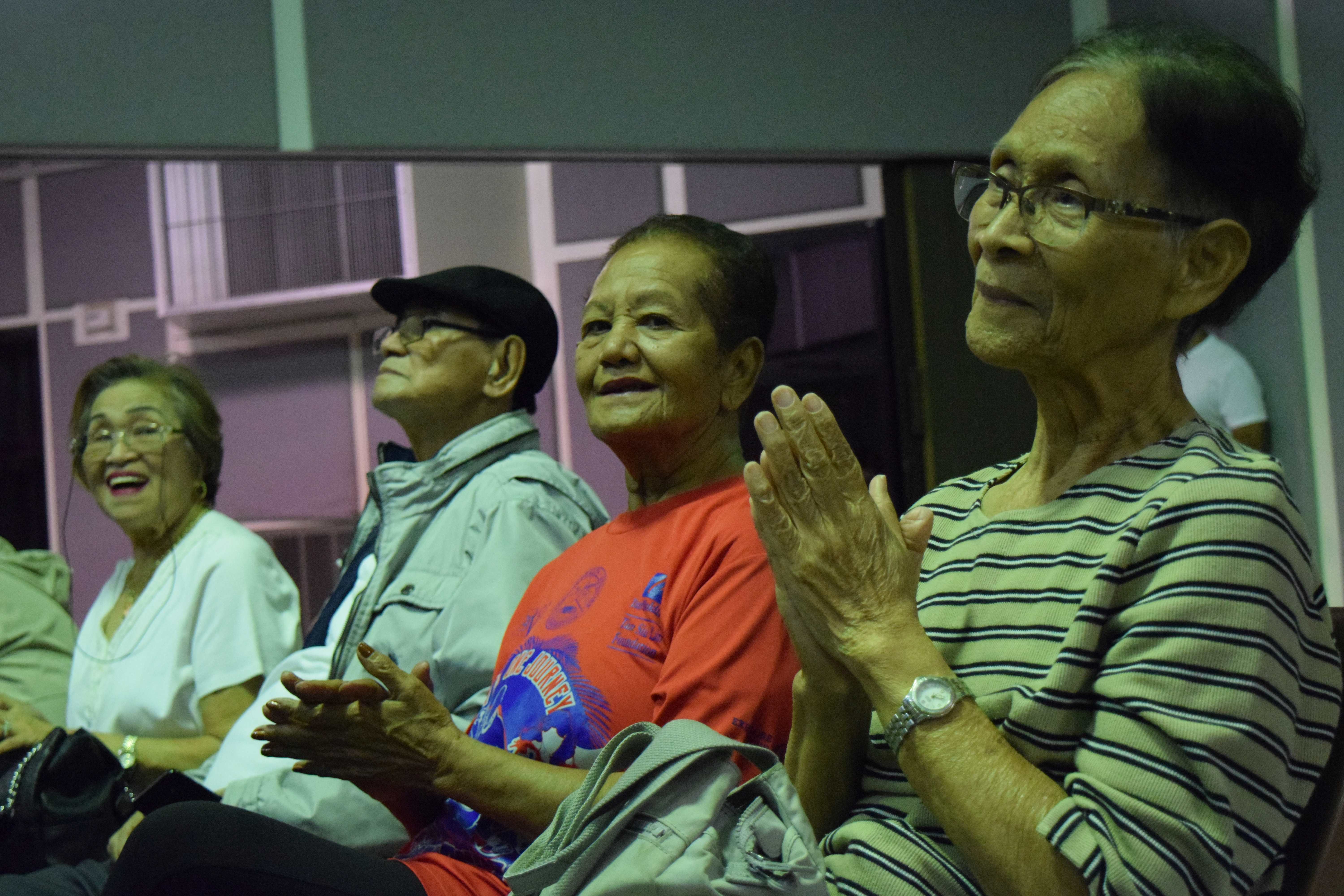 Senior citizens enjoy watching the performances.
