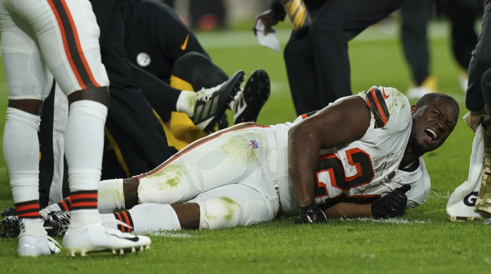 Cleveland Browns running back Nick Chubb grimaces on the field after an injury during the first half of an NFL football game against the Pittsburgh Steelers Monday, Sept. 18, 2023 in Pittsburgh.