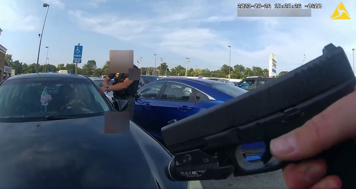 Body camera footage shows an officer fatally shooting a pregnant Black woman in the parking lot of a grocery store after she refused to exit her car and instead bumped him with her vehicle in Blendon Township, Ohio, U.S. August 24, 2023 in this still image obtained from a video. Blendon Township Police Department/Handout via REUTERS