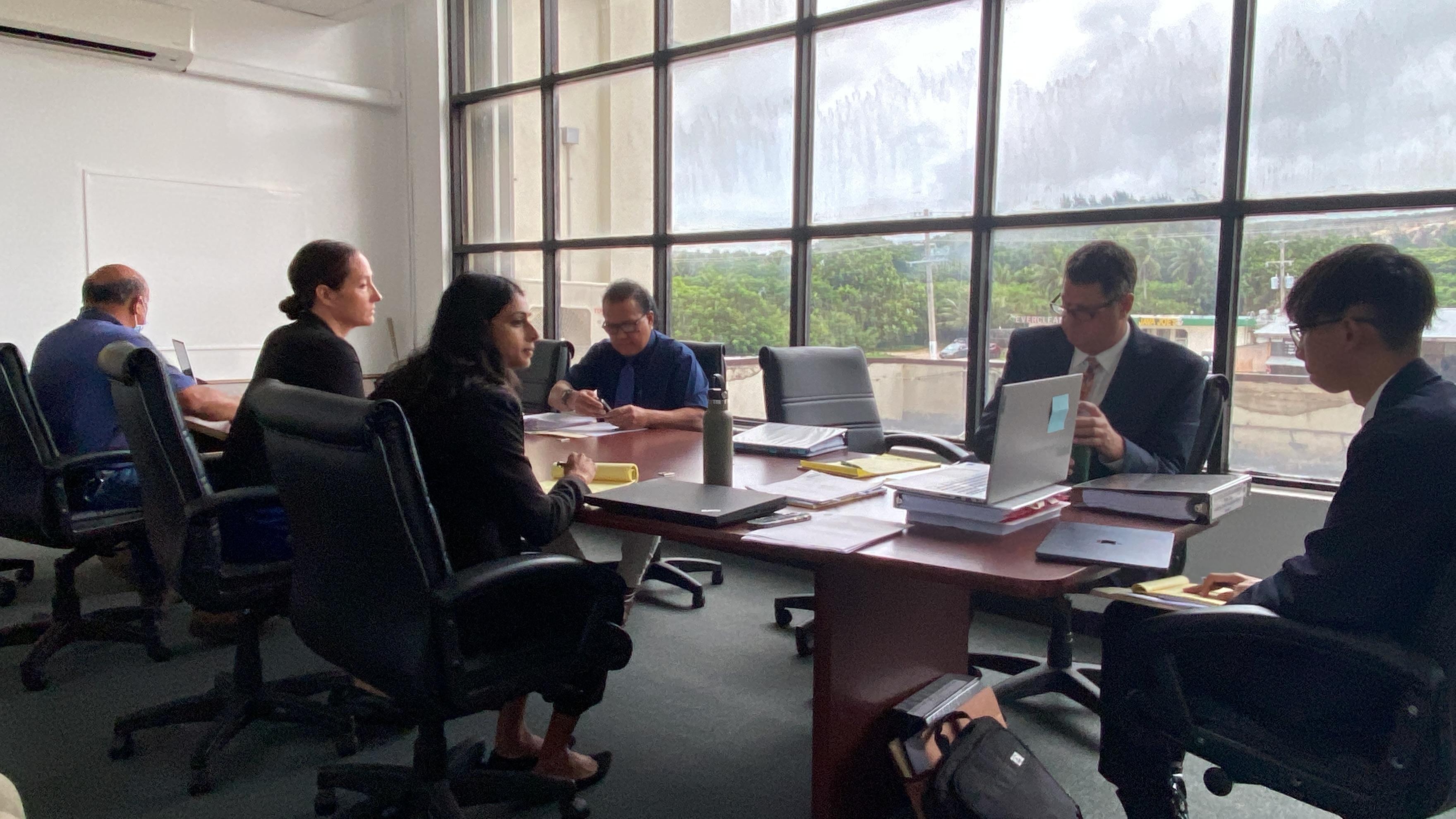 Front row: Assistant Attorneys General Ali Nelson and Vina Seelam, representing the Department of Public Lands. Back row, from left, DPL Hearing Officer Ramon Dela Cruz and attorney Colin Thompson, Rota Resort legal counsel during an  evidentiary hearing on Sept. 8, in the DPL conference room.
