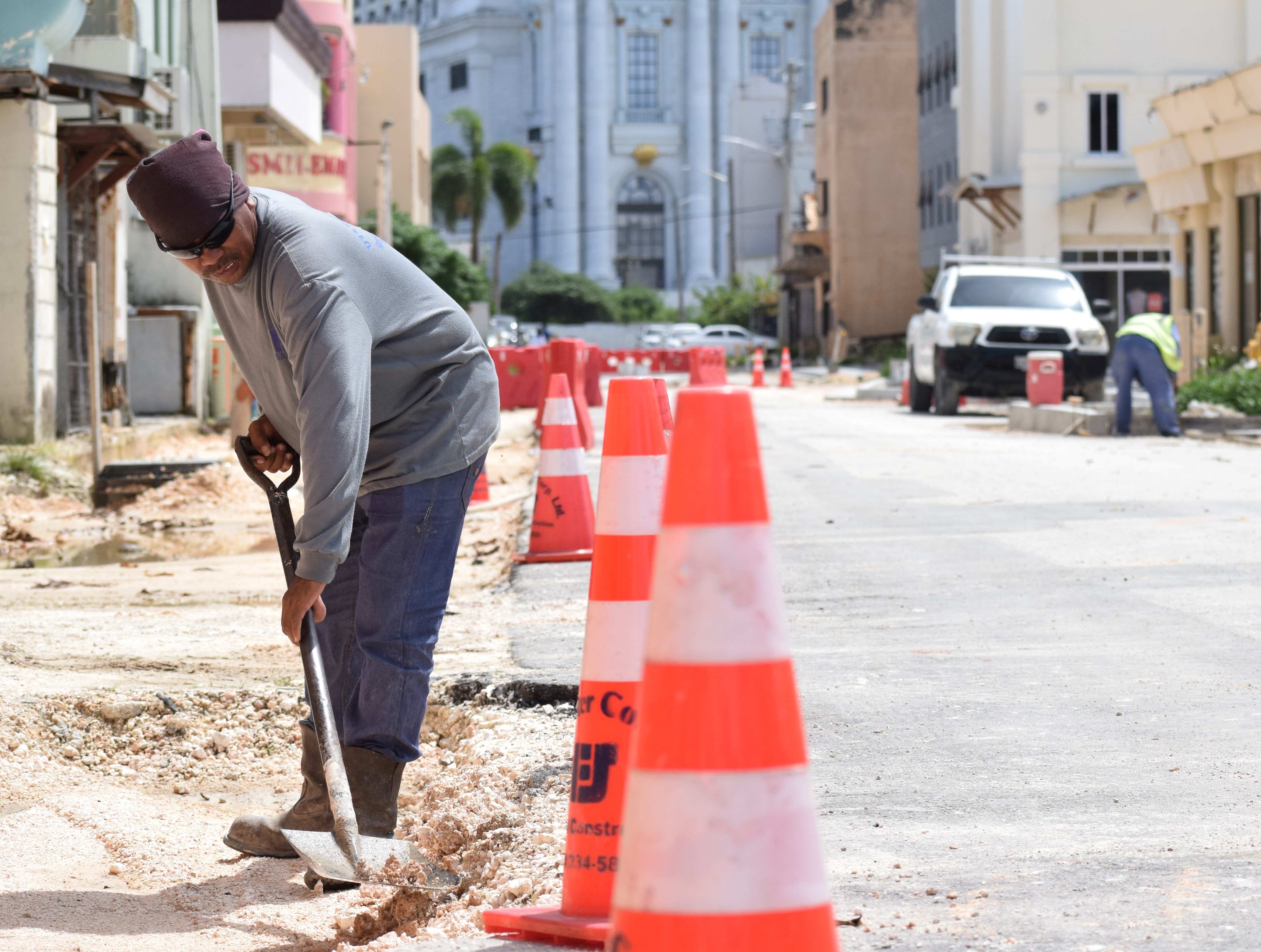 U.S.A. Fanter’s Ric De Villa works on a portion of a road that is part of the  Paseo De Marianas improvement project in Garapan.