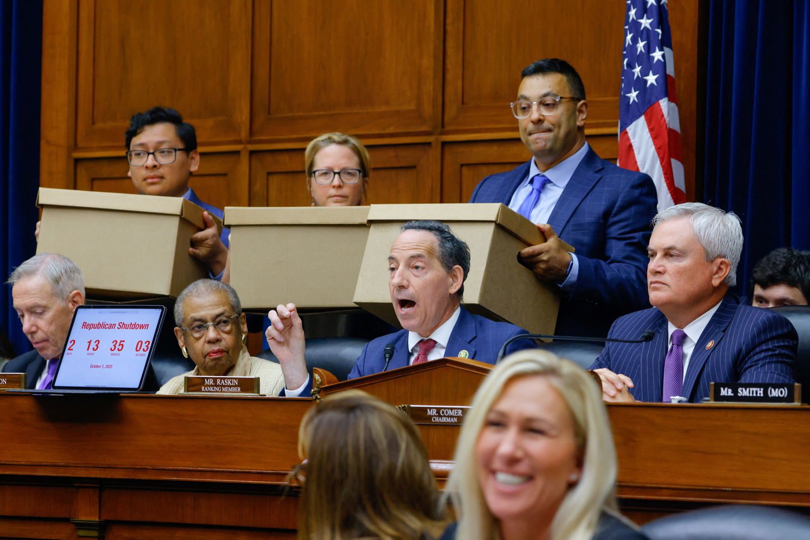 House Oversight Committee Ranking Member Rep. Jamie Raskin (D-MD) speaks as his aides hold boxes of what he said were thousands of pages of Biden family bank records subpoenaed by the committee as Chairman James Comer (R-KY) looks on during a House Oversight and Accountability Committee impeachment inquiry hearing into U.S. President Joe Biden, focused on his son Hunter Biden's foreign business dealings, on Capitol Hill in Washington, U.S., September 28, 2023. 