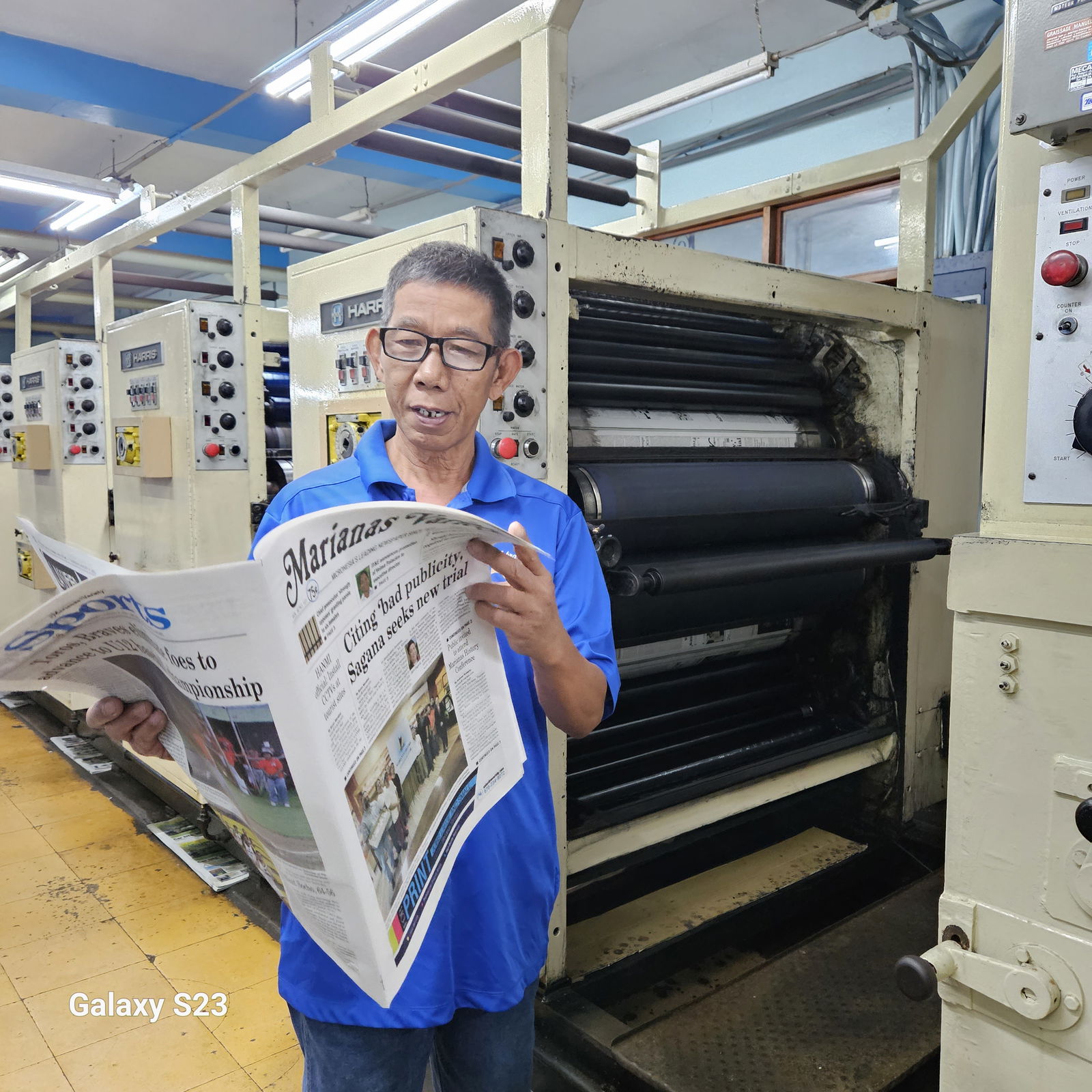 Arsenio Hembra reviews one of the daily papers he prints at Mvariety on August 31, 2023. 