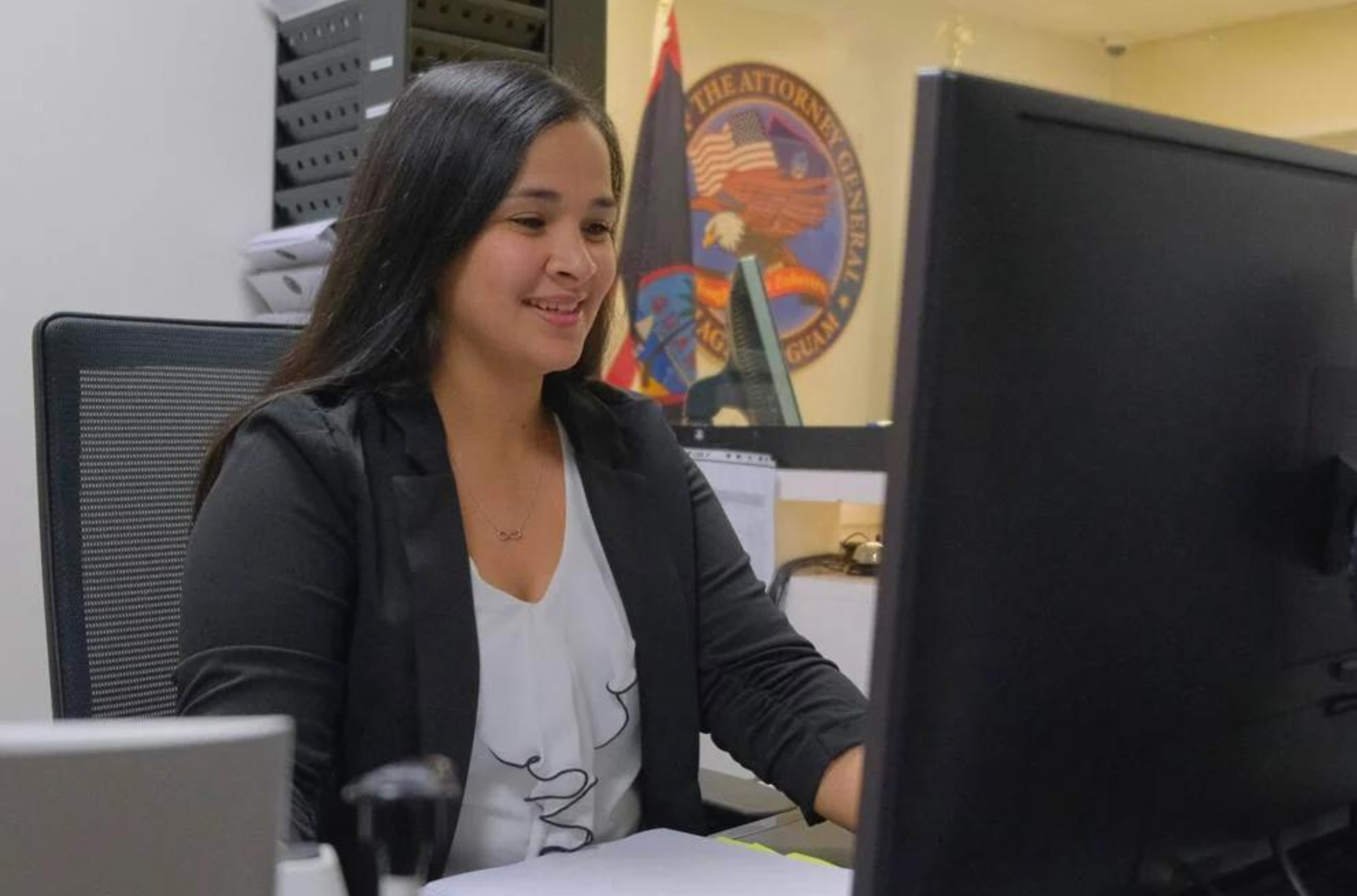 Administrative assistant Marichelle Gabay works at her desk in the Office of the Attorney General of Guam at the Guam International Trade Center in Tamuning on Thursday, Aug. 17, 2023.