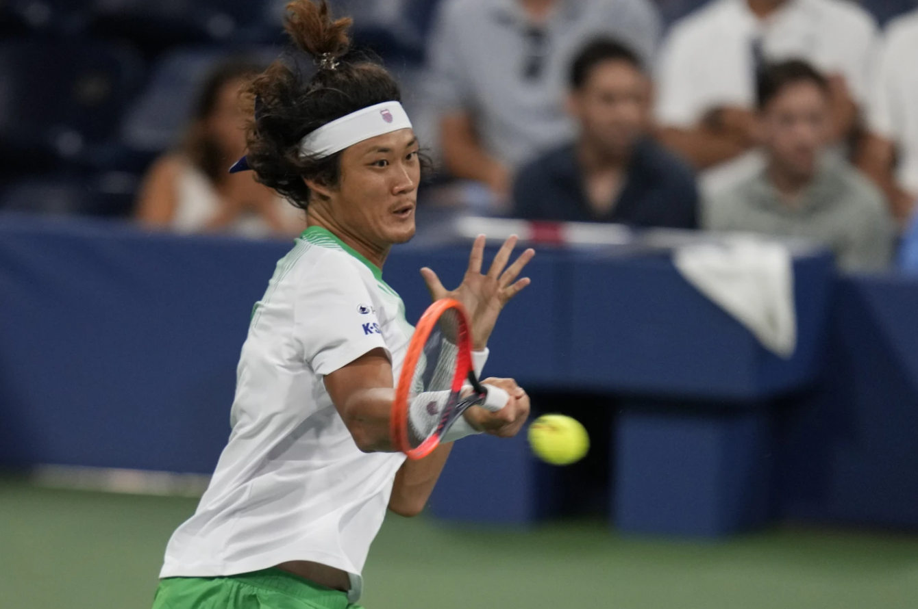 Zhang Zhizhen of China returns a shot to Casper Ruud of Norway during the second round of the U.S. Open tennis championships, Wednesday, Aug 30, 2023, in New York.