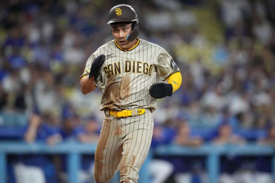 San Diego Padres second baseman Ha-Seong Kim (7) scores in the first inning against the Los Angeles Dodgers at Dodger Stadium in Los Angeles, California, Sept. 11, 2023.