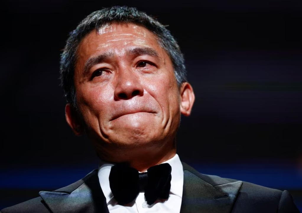 Actor Tony Leung Chiu-Wai reacts as he receives the Golden Lion award for lifetime achievement at the 80th Venice Film Festival in Venice, Italy, Sept. 2, 2023.