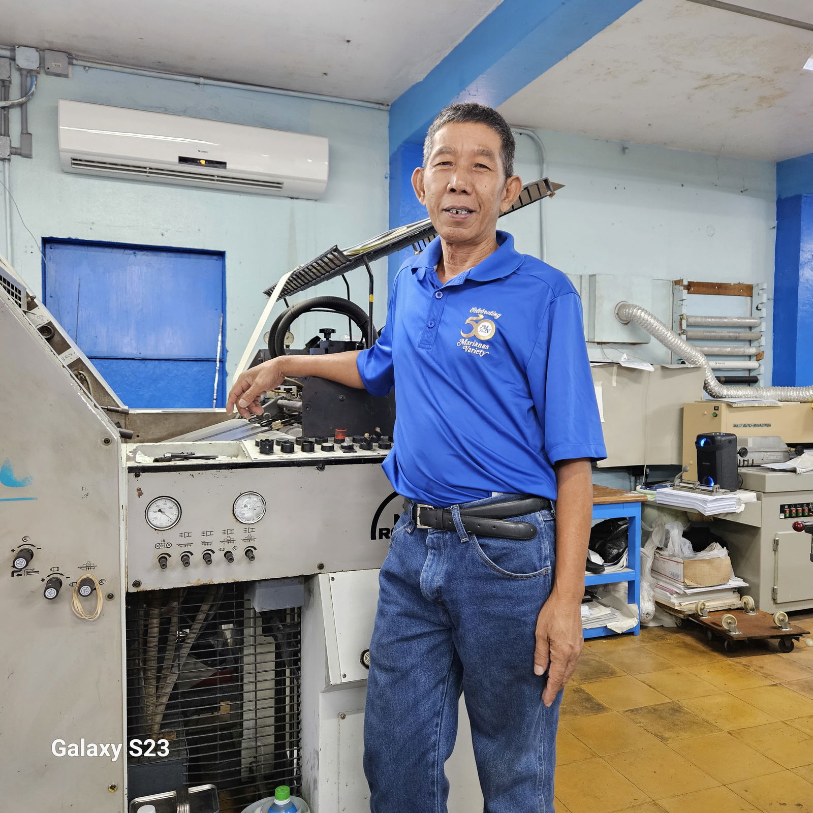 "Kuya Arsen" poses with one of the machines he operates at Mvariety on August 31, 2023. 