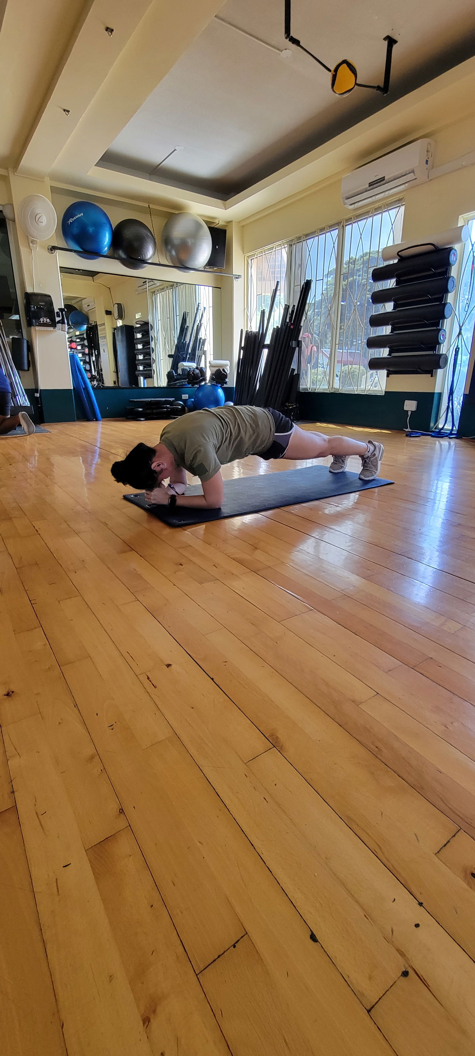 Michele Masga, a certified personal trainer at Gold's Gym Saipan, demonstrates a plank, which will be featured at this Friday's Abs & HIIT class.