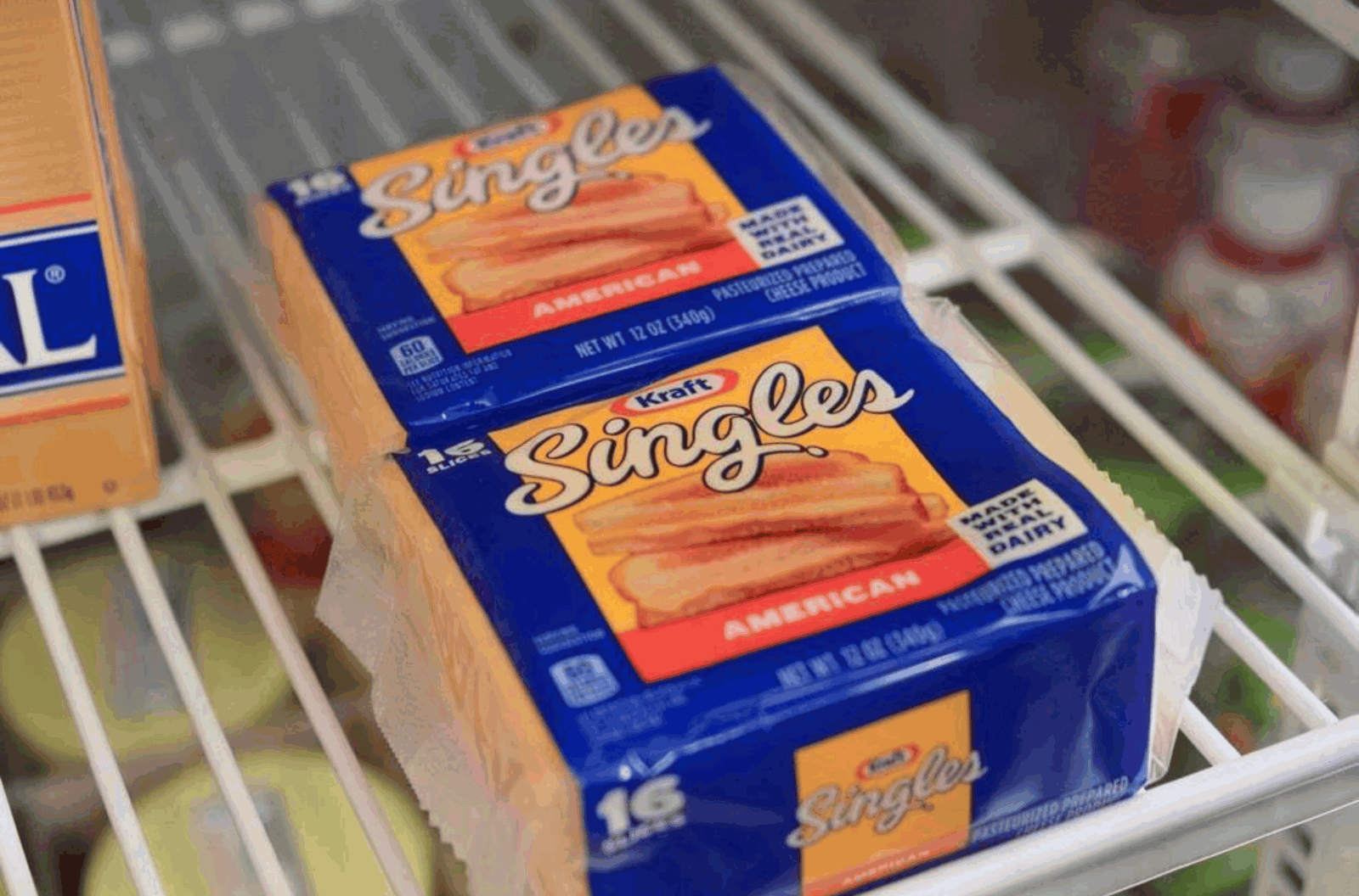 Packages of Kraft Singles American cheese products are displayed in a store in Chalan Pago on Wednesday, Sept. 27, 2023. A voluntary recall was issued by the Kraft Heinz company on select Kraft Singles American processed cheese slices. 